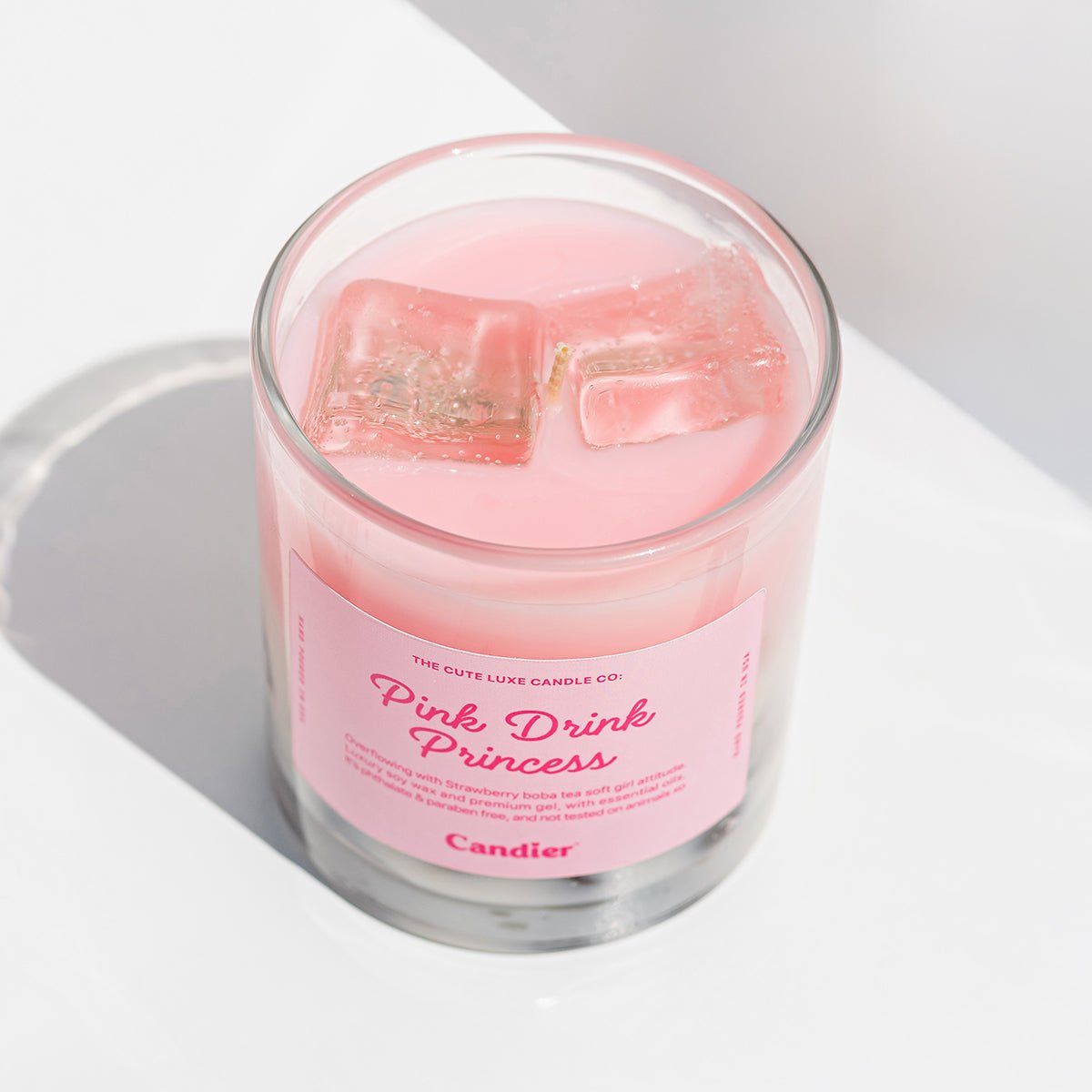 Cute candle with strawberry boba latte scent labeled 'Pink Drink Princess' with a pink aesthetic label on a white background