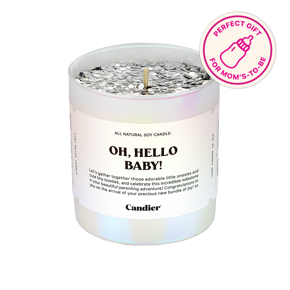 a glitter topped scented candle with a label that reads Oh Hello Baby and a banner that says perfect gift for Moms to be