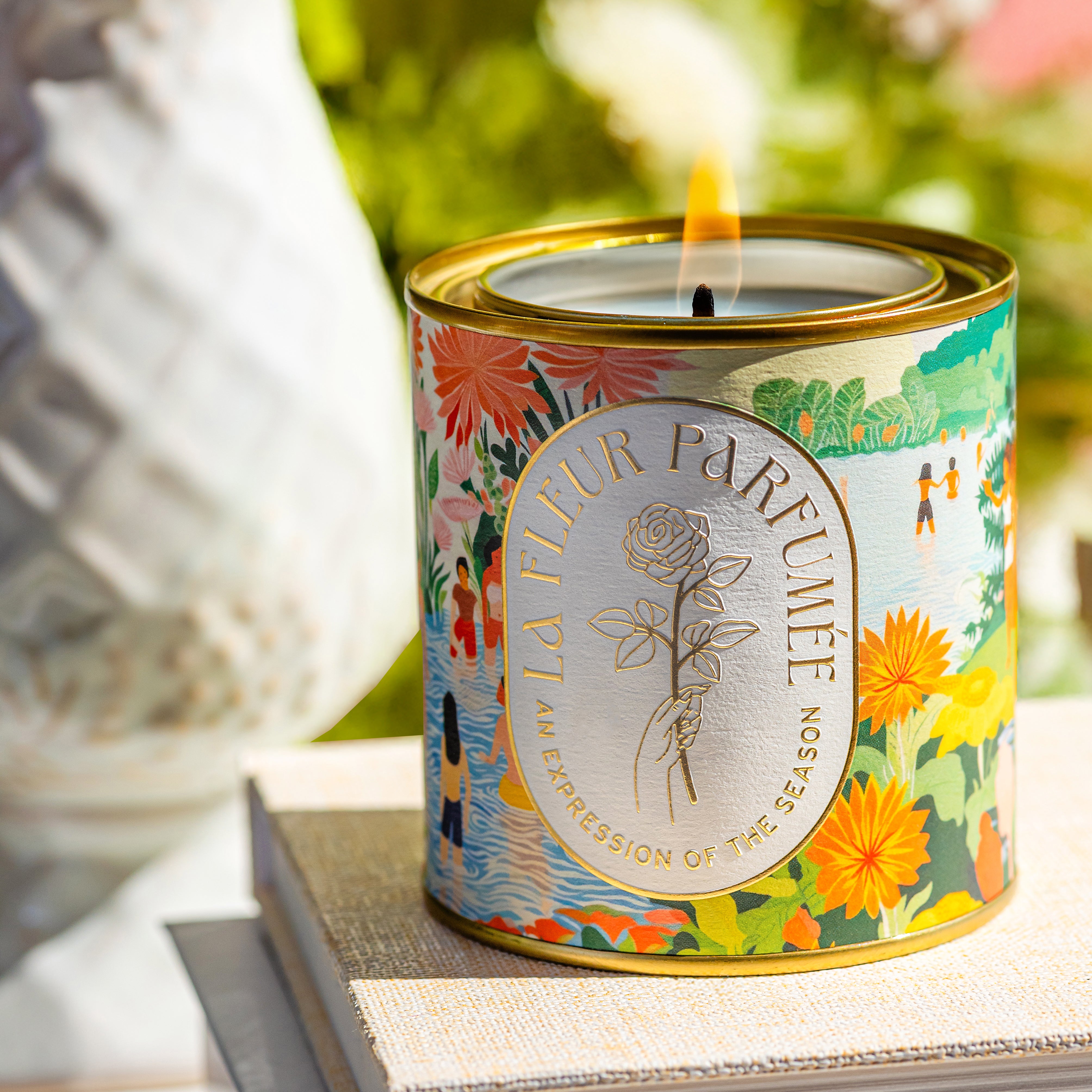 Clean-burning soy wax Hamoa Beach luxury candle styled with tropical greenery, white lotus resort-inspired scent