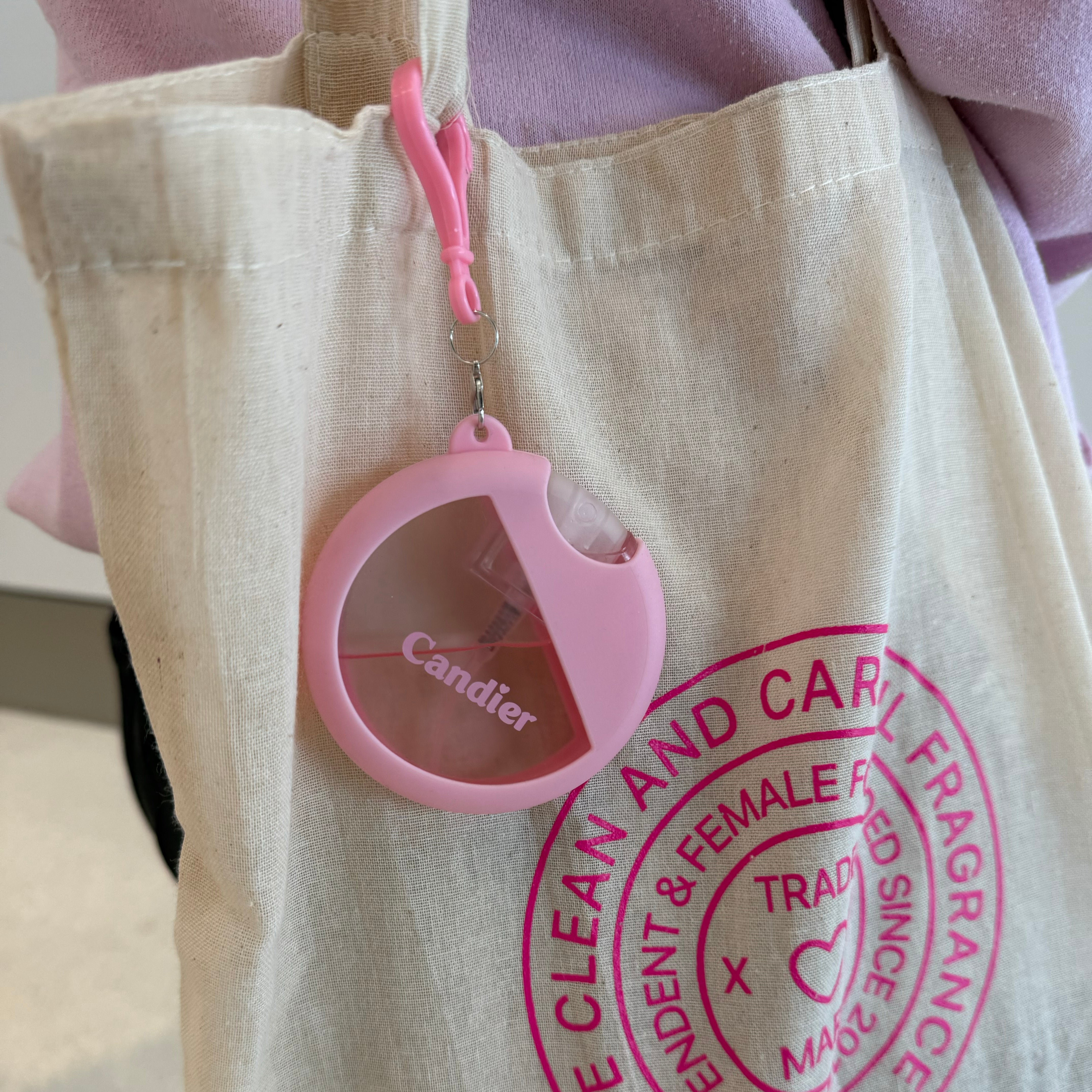 Candier Scented hand sanitizer with cute holder case keychain attached to cute pink tote bag