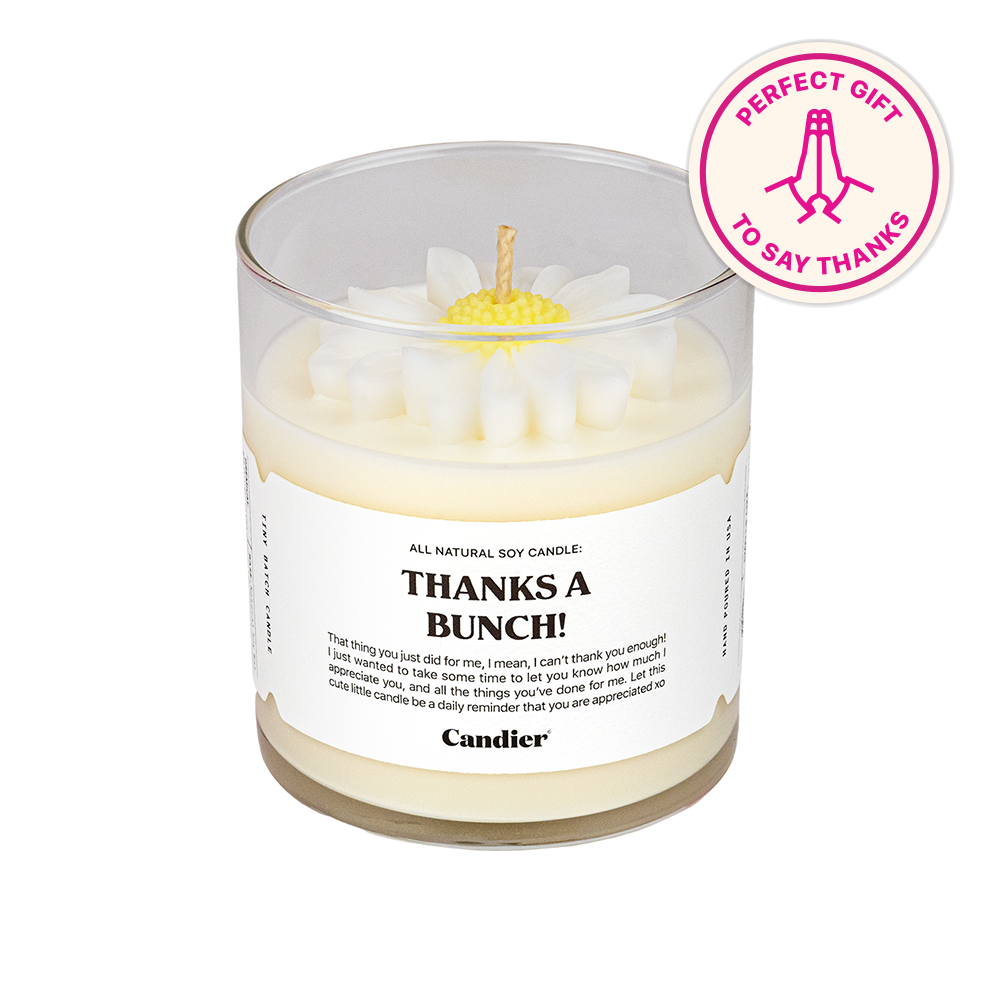 a scented candle with a molded wax flower on top, a label that reads thanks a bunch and a banner that says perfect gift to say thanks 