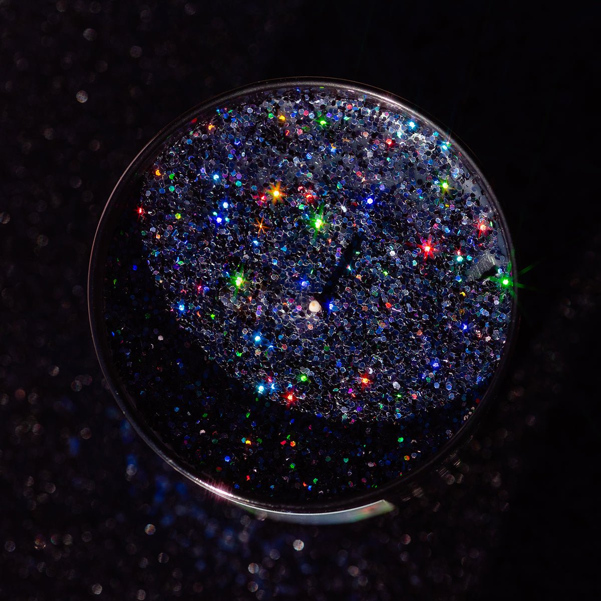 Top view of CandierĀ® Hello My Pretties candle showing sparkly black eco glitter wax ā a wicked luxe candle for Halloween and cute aesthetic displays.