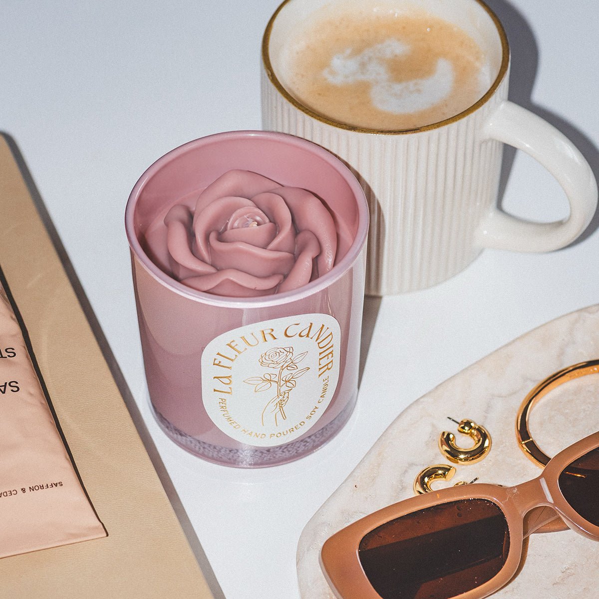 Candier candles flower candle styled with coffee and accessories, a cute candle with floral scents and aesthetic room decor