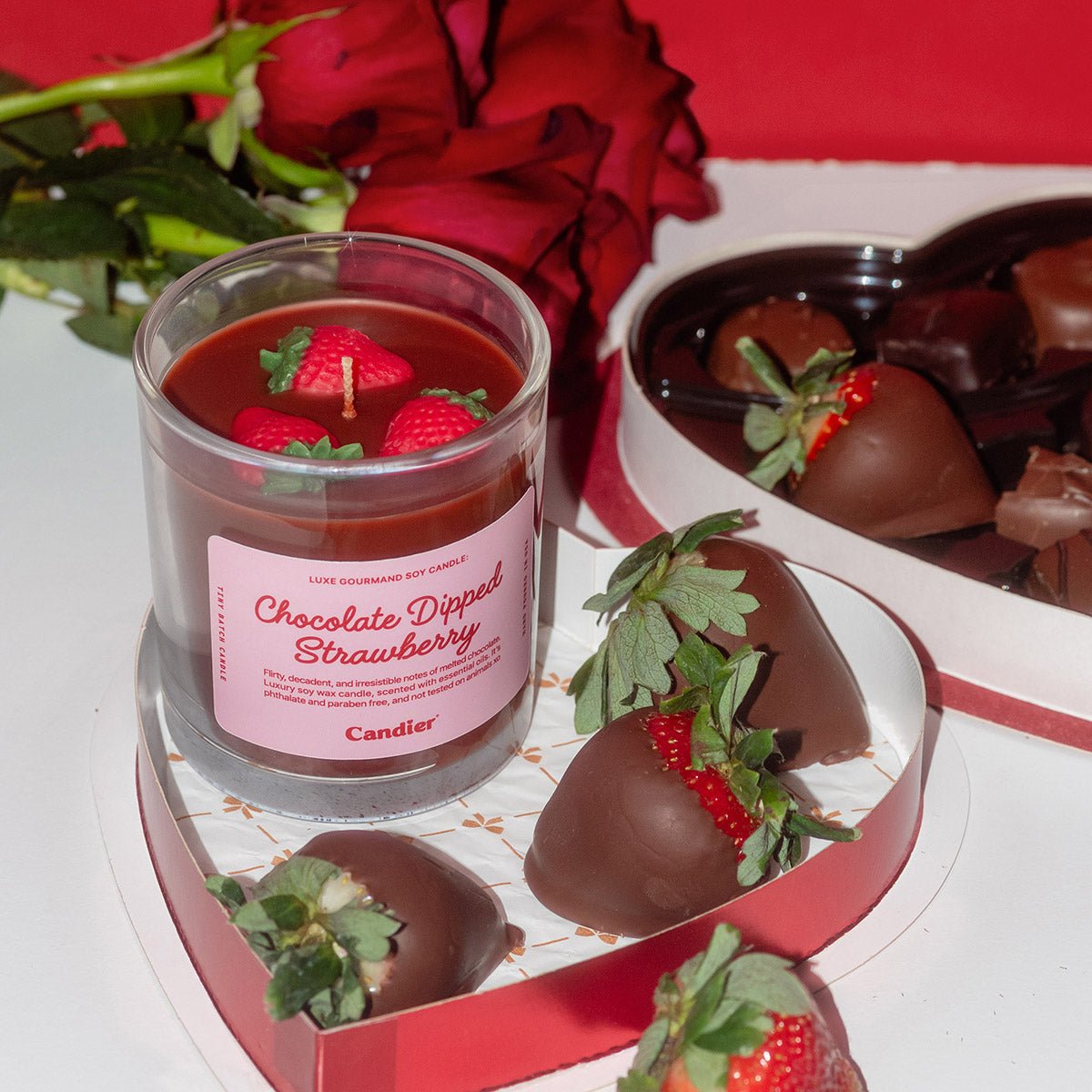 Candier Chocolate Dipped Strawberry candle styled with fresh strawberries and red roses for a romantic Valentine’s Day dessert candle aesthetic