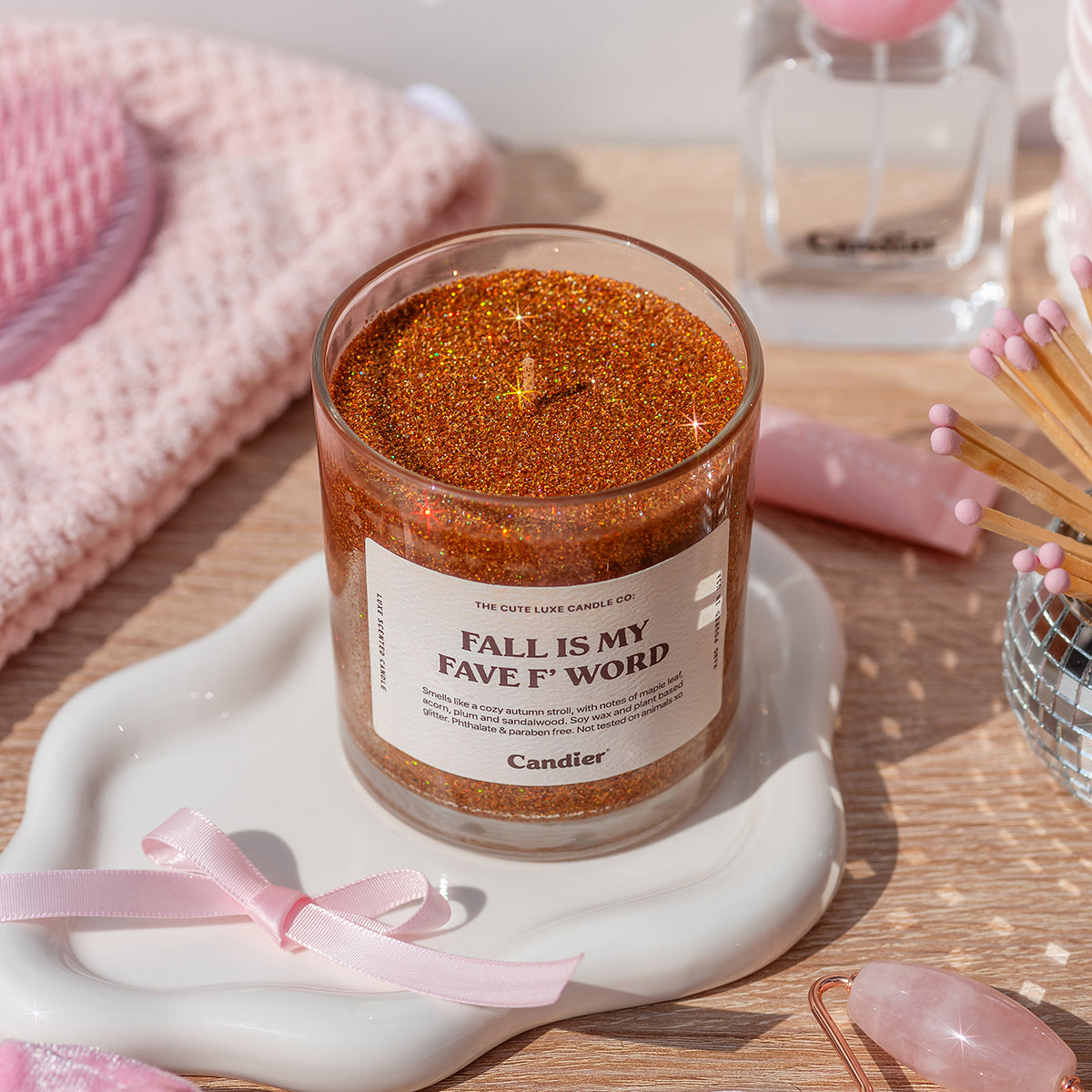 Candier cute aesthetic pretty candles styled with cozy fall decor, a luxe sweater weather candle perfect for gifting.