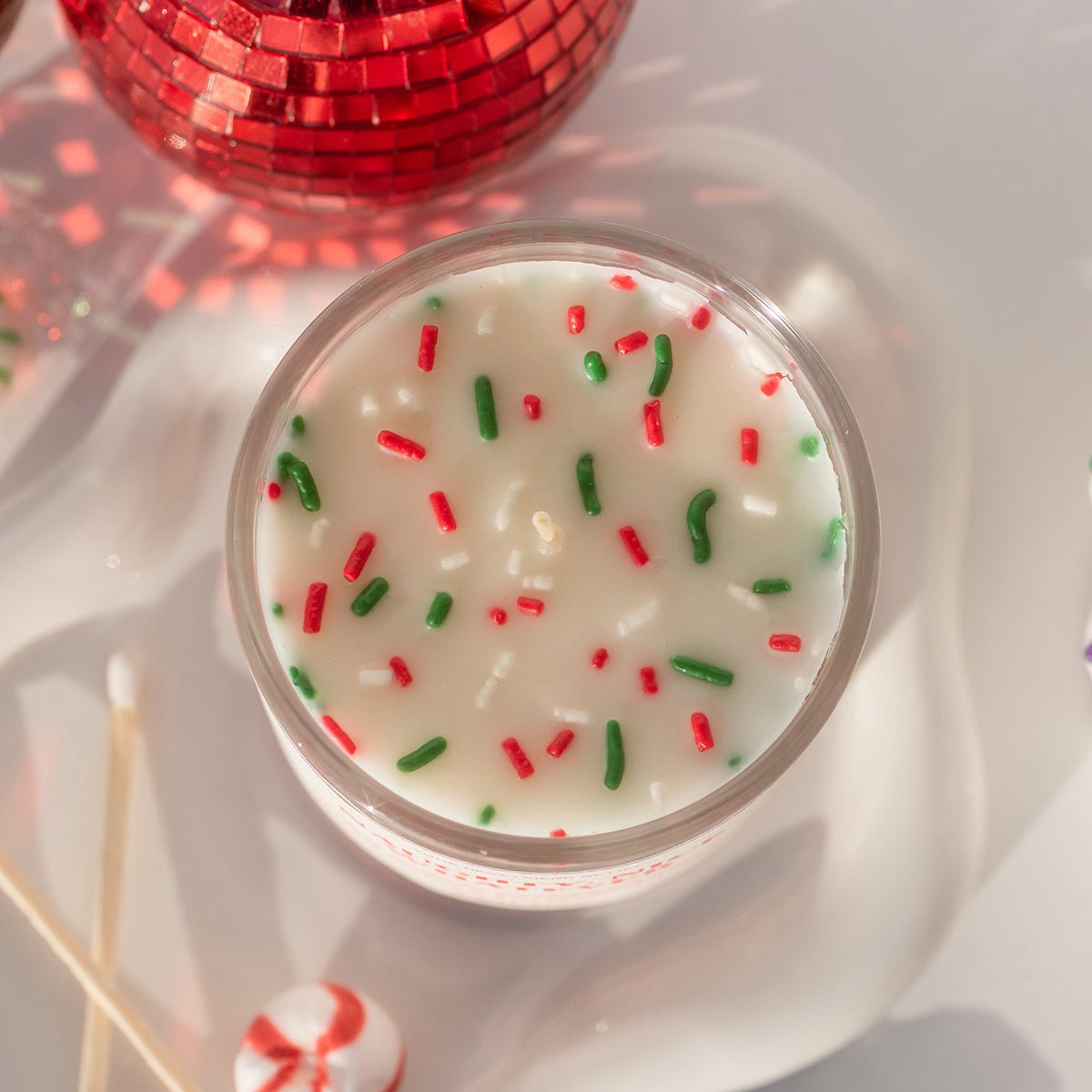 Top view of peppermint mocha cute candle with festive sprinkles—pretty Christmas candle; Christmas gifts for sisters and christmas gift teens.