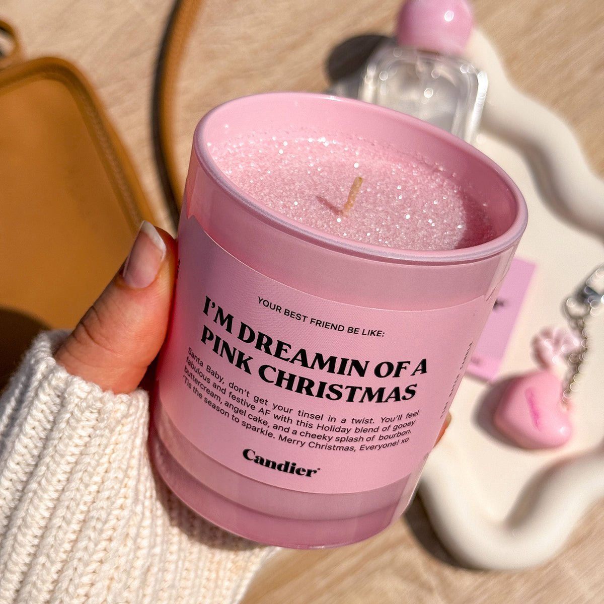 Candier pink Christmas candle close-up ā one of the best Secret Santa gifts and cute candles for Christmas gifts for friends.
