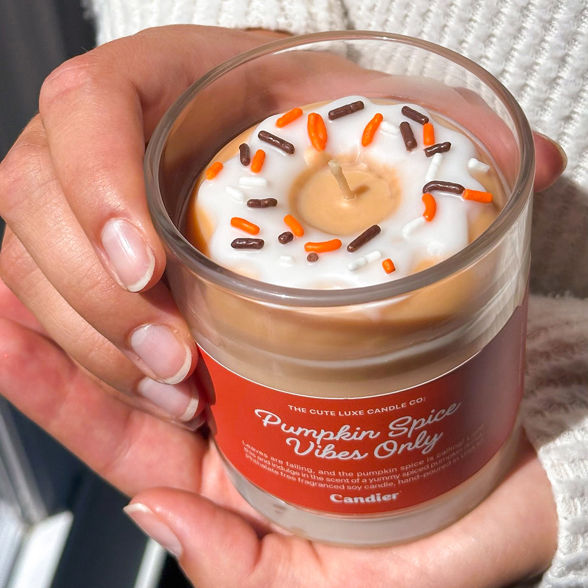 Cute Candier pumpkin spice candle with sprinkles donut, cozy candles for fall, luxe aesthetic gift idea for teen girls and young women.