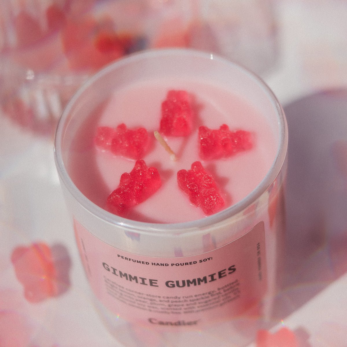 Gimmie Gummies by Candier in a soft pink aesthetic lifestyle photo, a pretty candle and cute candle for cute room decor