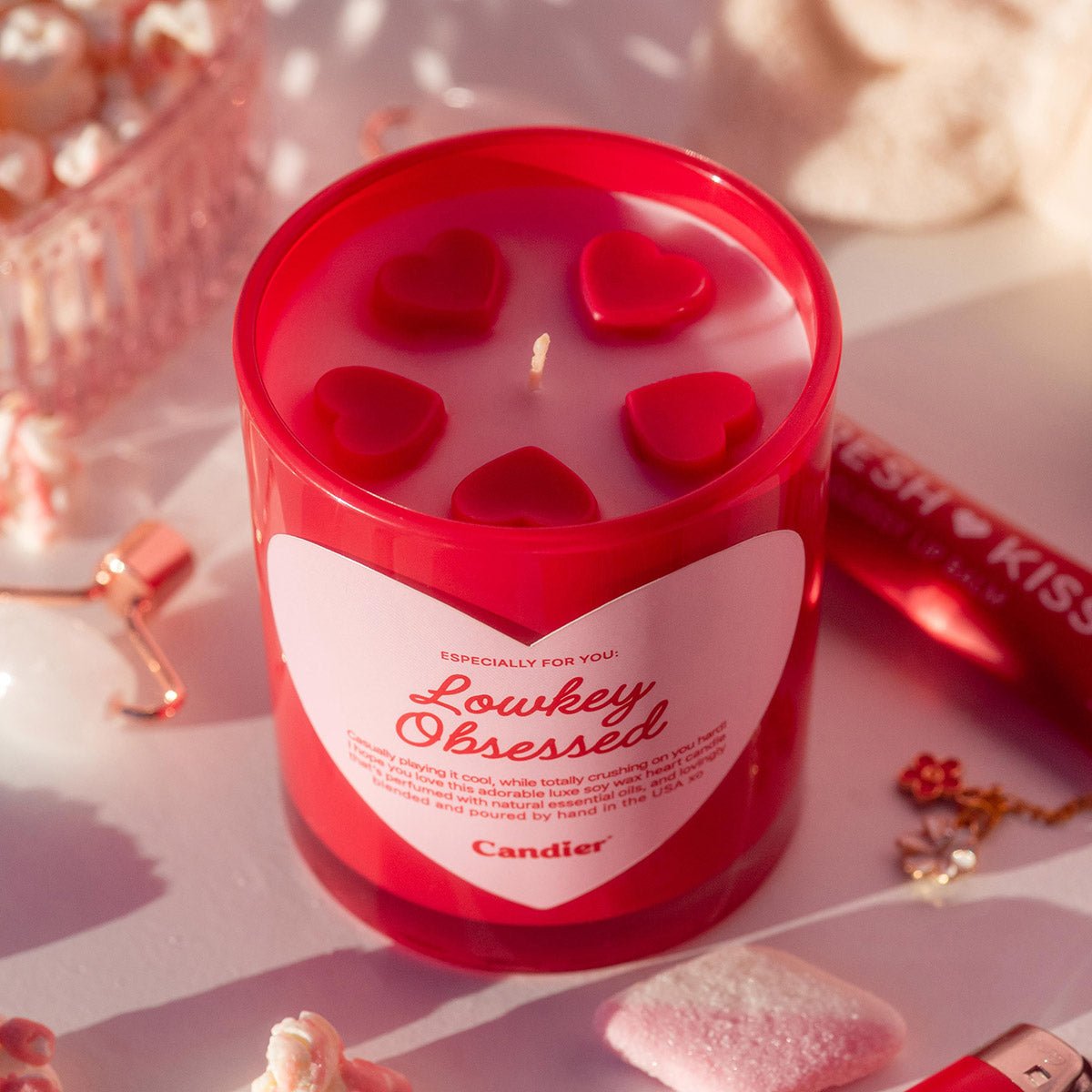 Top view of Candier Lowkey Obsessed candle with molded wax hearts, a romantic Valentine candle and aesthetic gift for women