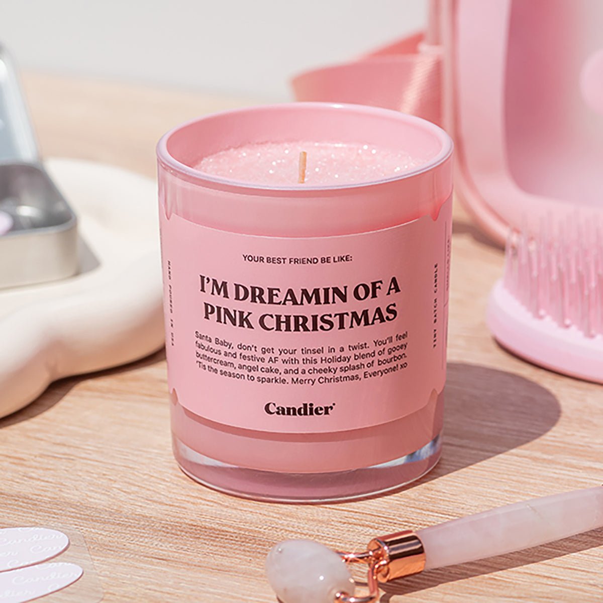 Pretty pink Christmas candle by Candier â lux candle for soft girl aesthetic decor and best Christmas gifts for women who love cute candles.