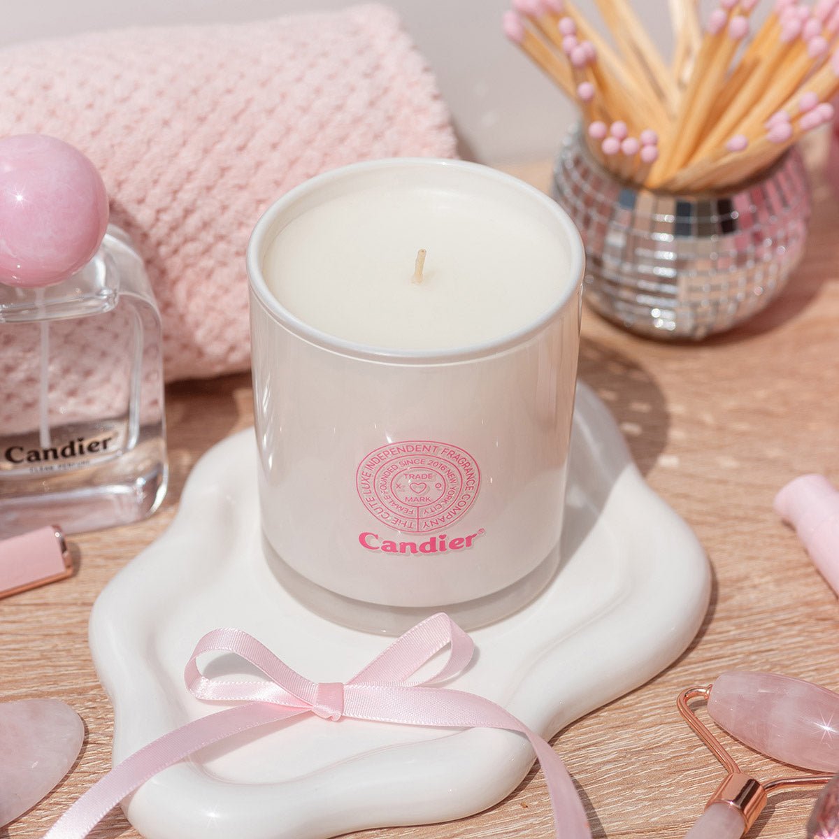 Back view of Candier Cereal Milk Candle styled with luxe aesthetics and cute decor. A sweet scented cereal milk candle that’s perfect as a pink candle gift for her.