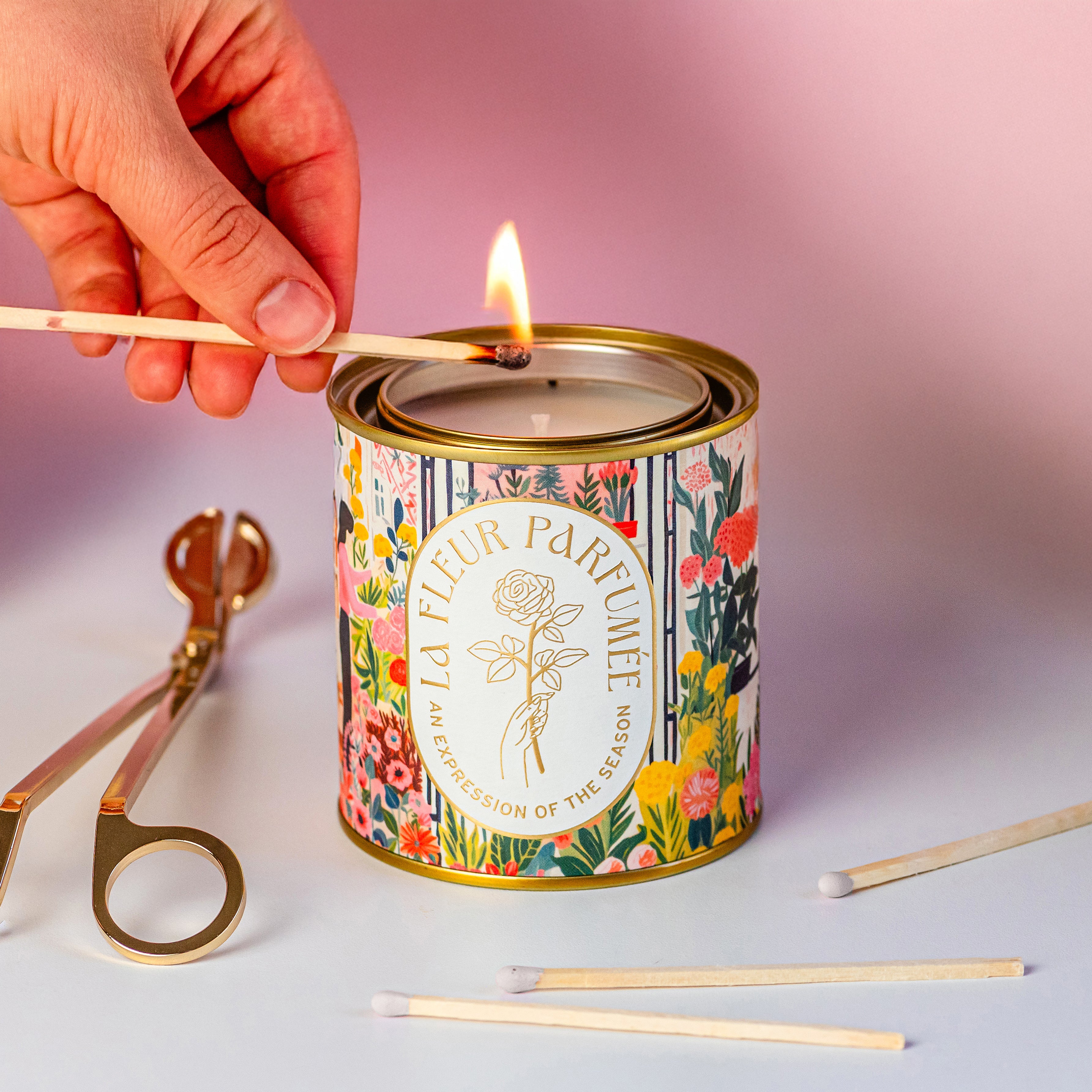 Lighting a floral scent candle with match â features neroli scent, tea rose, and musk fragrance notes for relaxing fresh scents