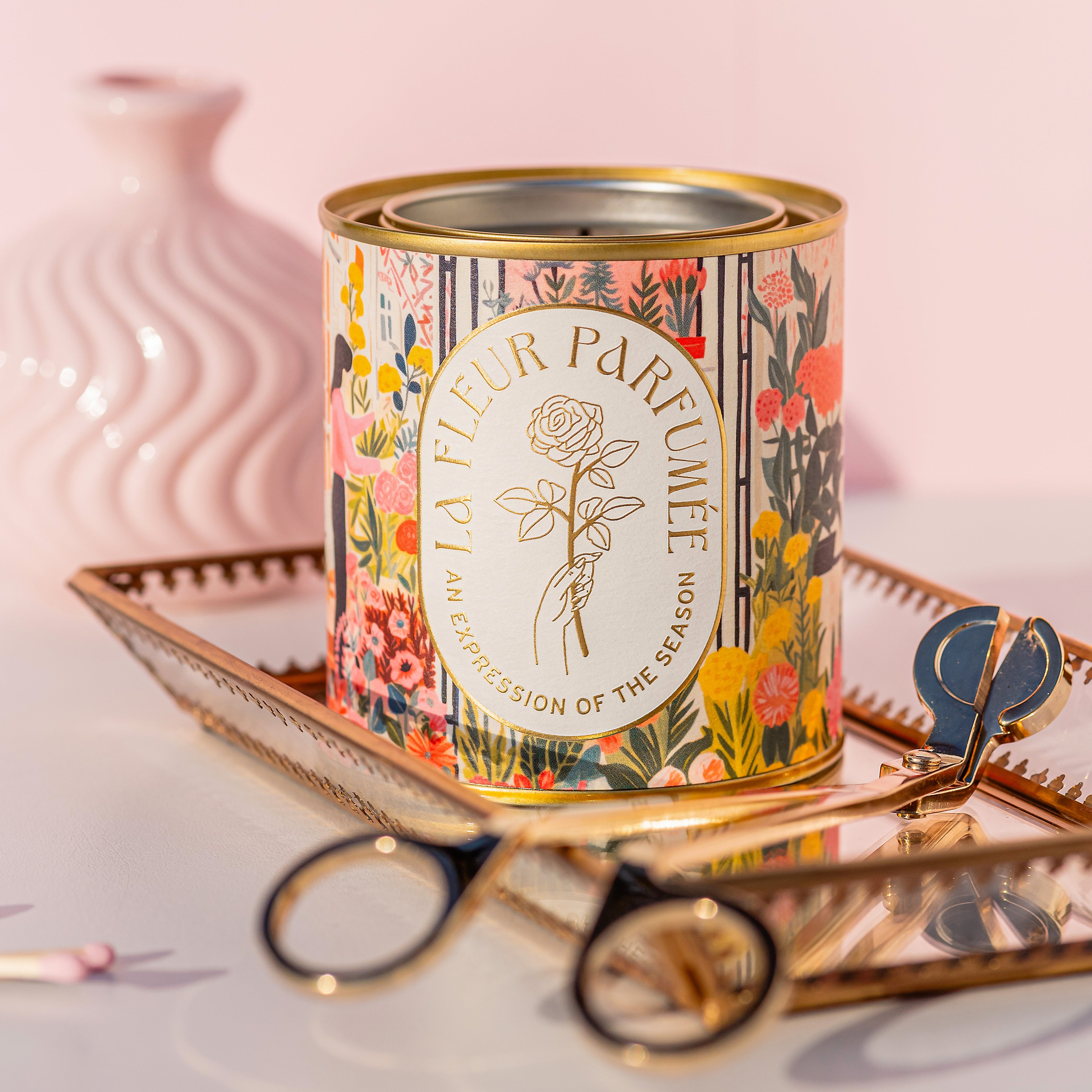 Candier neroli scent floral candle styled on book with gold wick trimmer â ideal for gifting with luxe aesthetics