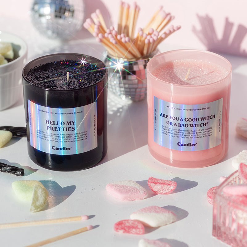 CandierĀ® Hello My Pretties and Are You a Good Witch or a Bad Witch candles styled together, the ultimate wicked and good witch duo for cute Halloween room decor.