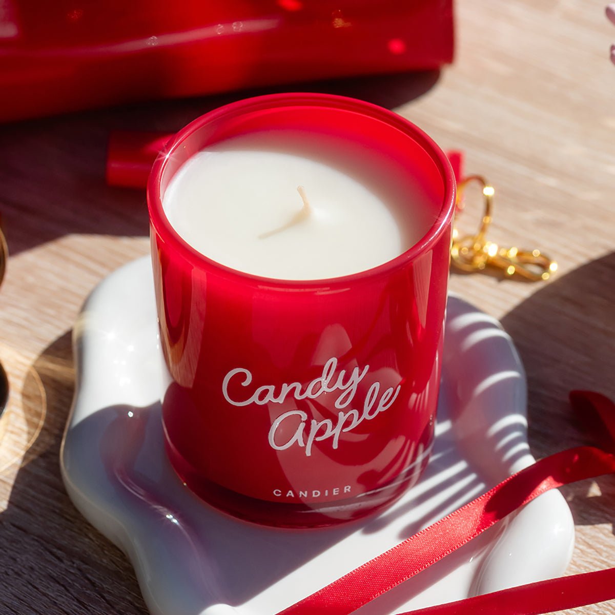 Moody holiday candles scene — classic apple cinnamon candle and best Christmas gifts for mom.