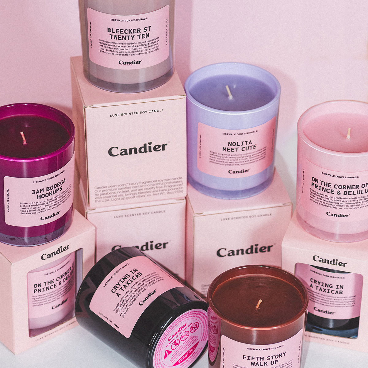 Collection of Candier NYC candles in pink aesthetic packaging, featuring cute candles and luxury candles styled as cute room decor and gifts for her.