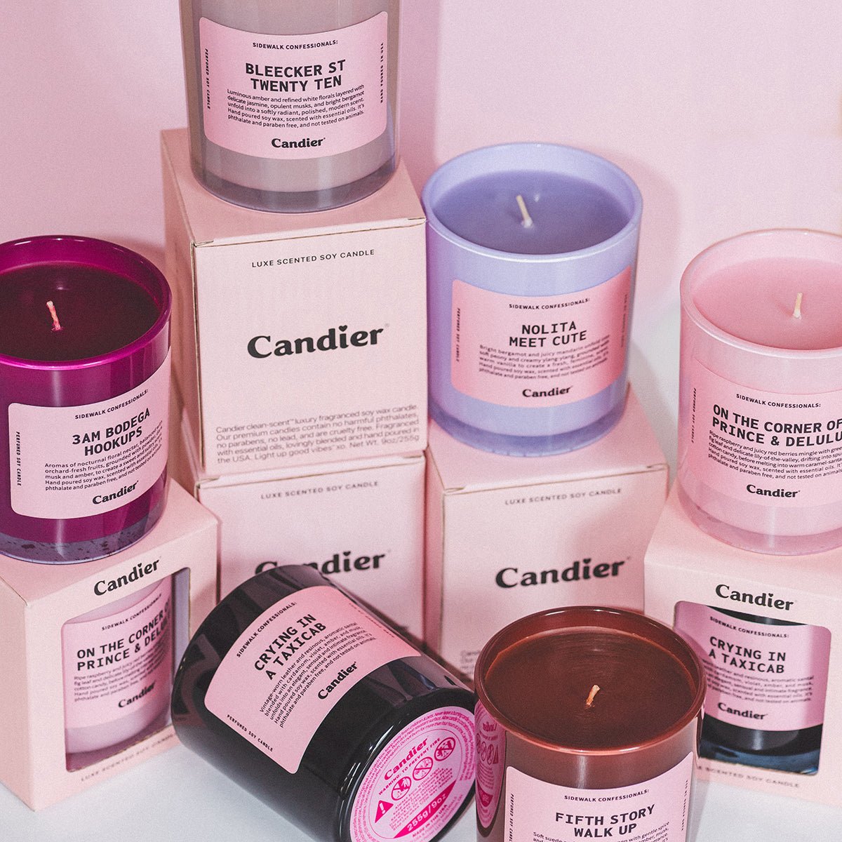 Collection of Candier NYC candles in pink aesthetic packaging, featuring cute candles and luxury candles styled as cute room decor and gifts for her.