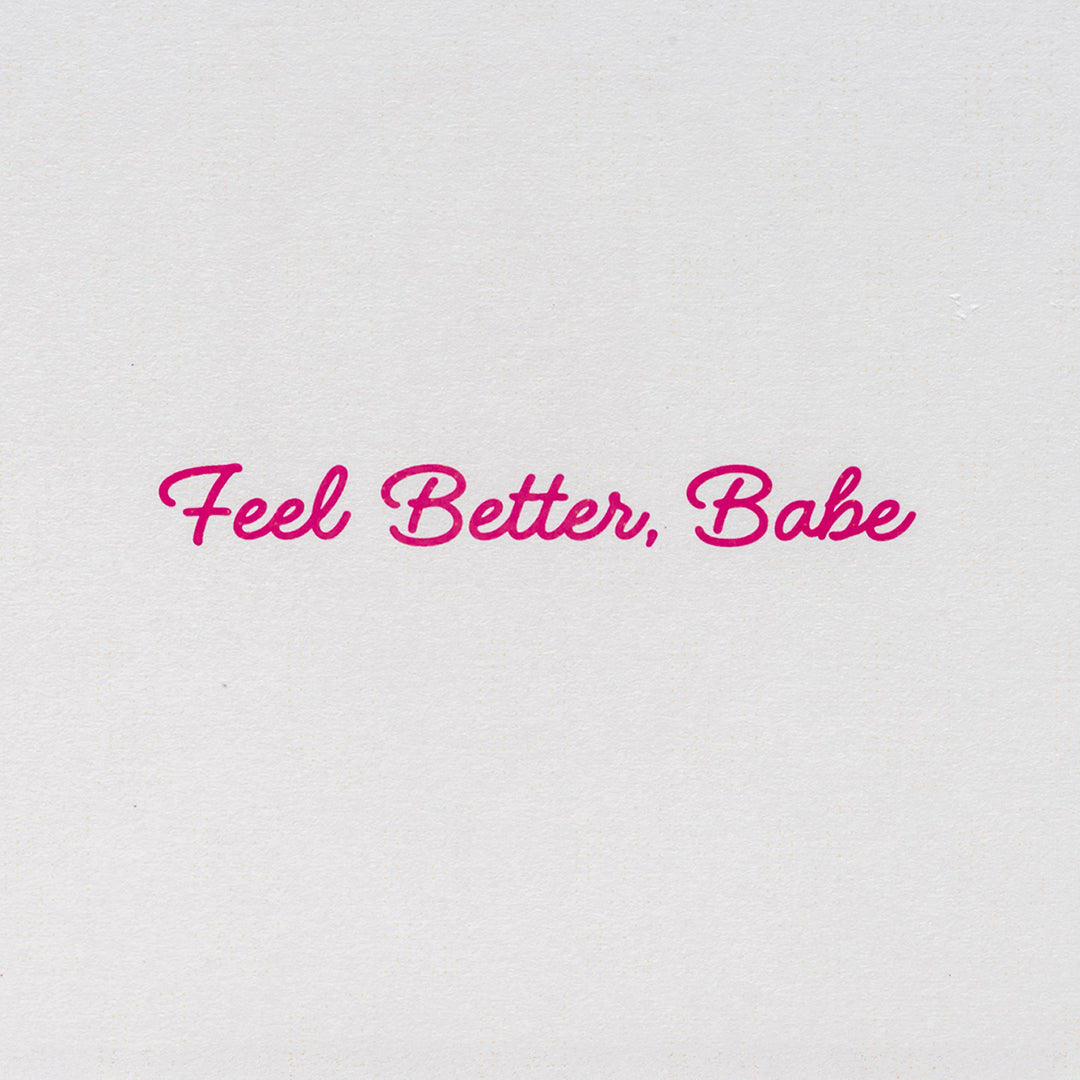 Inside message of Candier get well card reads "Feel Better, Babe" in pink script