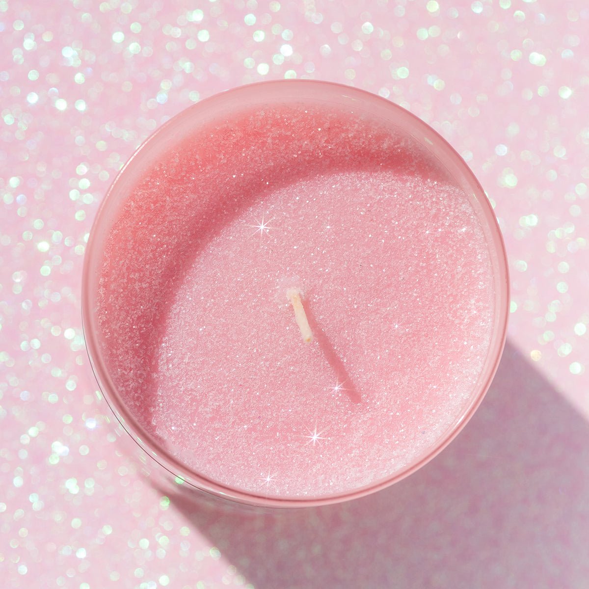 Top view of CandierĀ® Are You a Good Witch or a Bad Witch candle showing sparkly pink eco glitter wax, ideal for cute room decor and soft girl aesthetic setups.