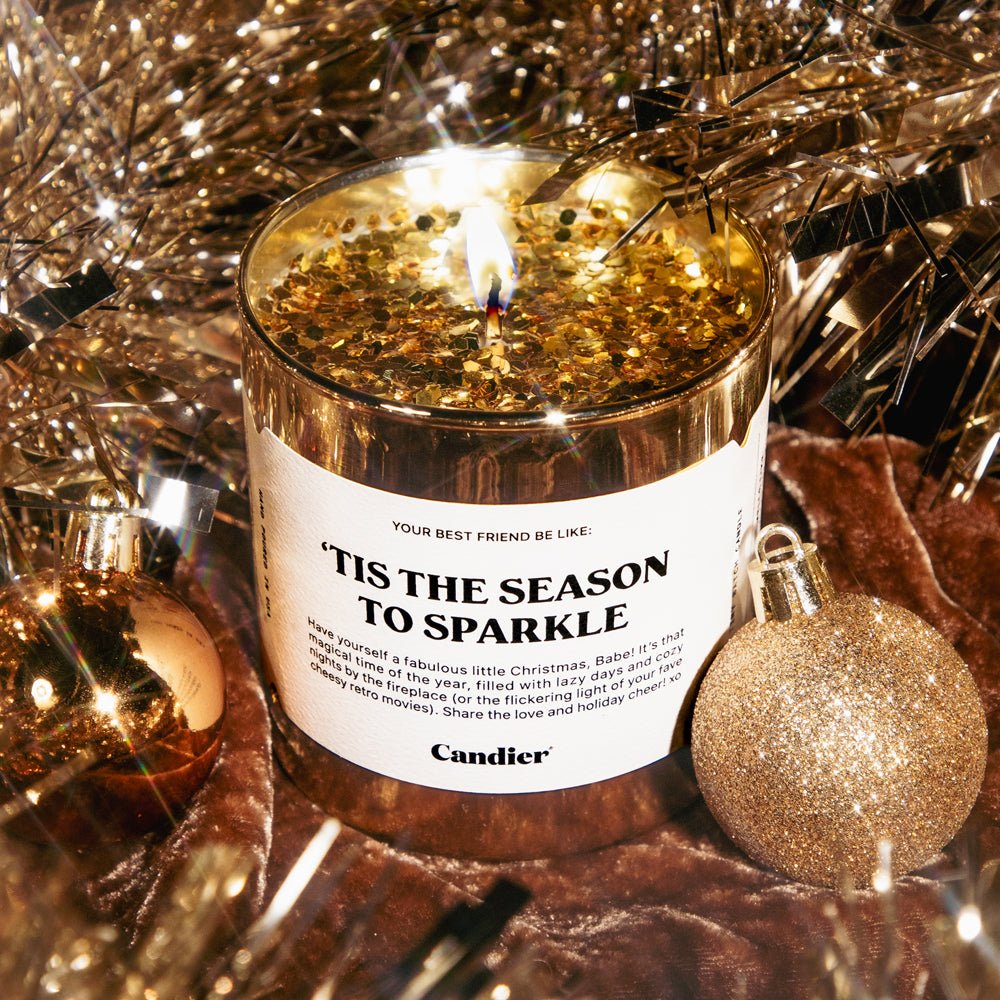 Glam lifestyle shot of Candier christmas candles — ’Tis The Season To Sparkle cinnamon candle; perfect christmas gifts for friends and christmas gifts for sisters.