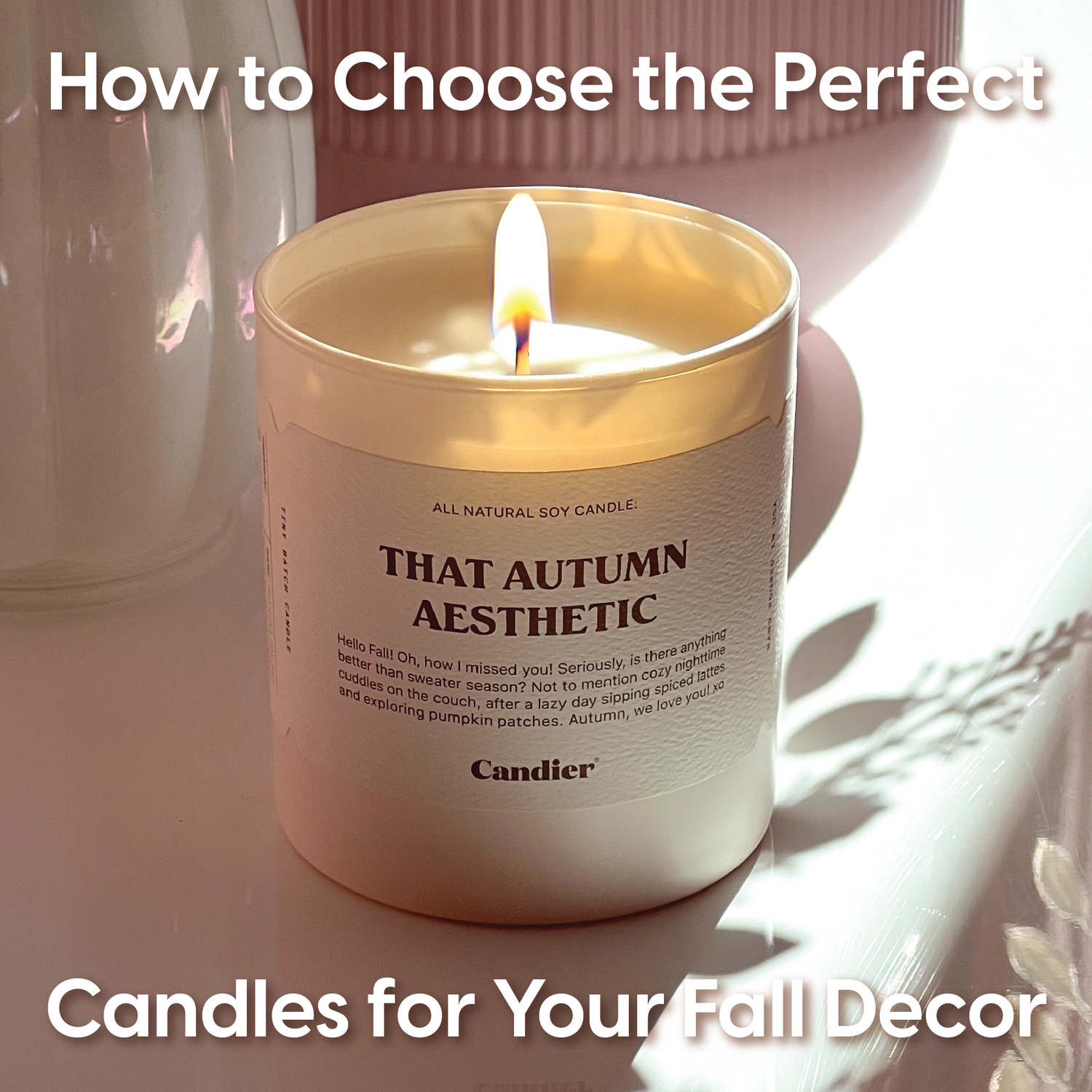 How To Choose The Perfect Candles For Your Fall Decor text over an image of a lit luxury candle with a label that reads That Fall Aesthetic