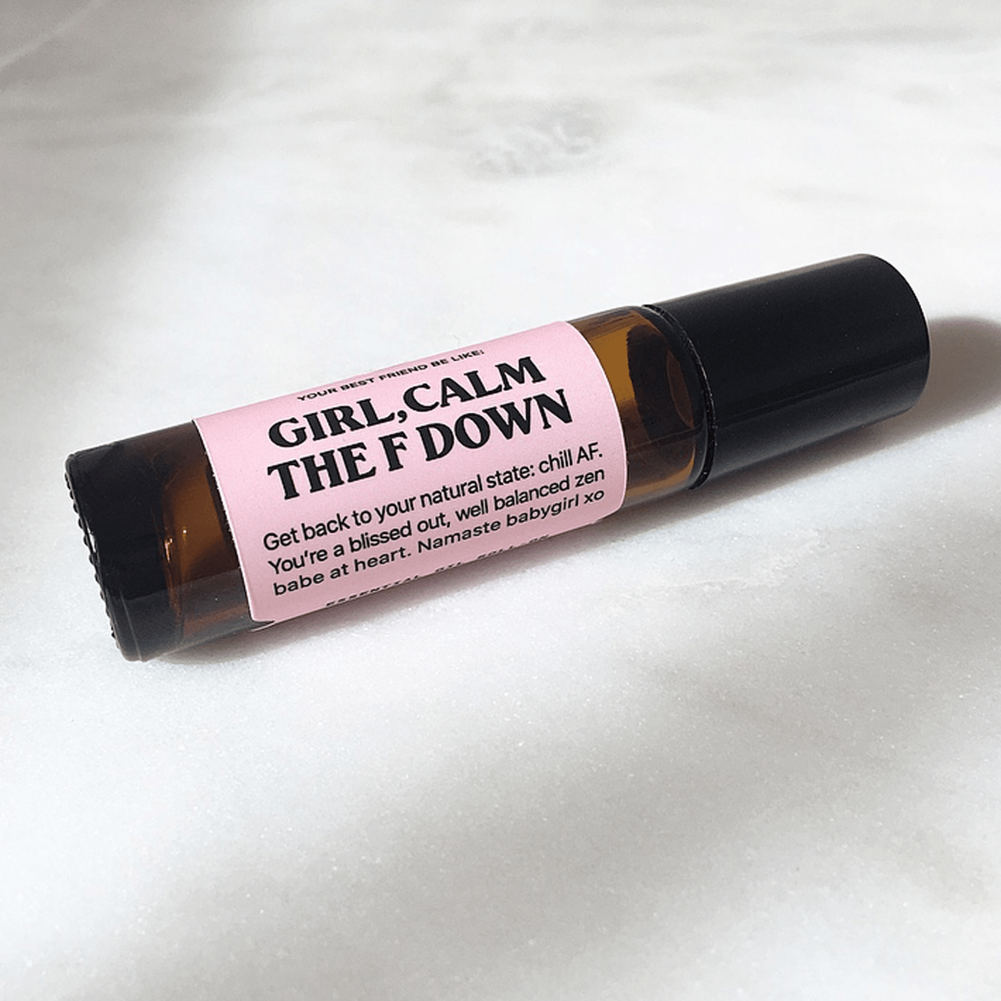 brown roller ball tube with pink label