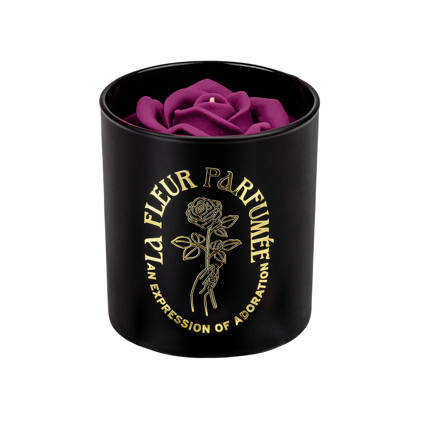 An elegant luxurious black candle with a gold emblem that reads La Fleur Parfumée An Expression of Adoration, and is topped with a purple sculpted wax rose 