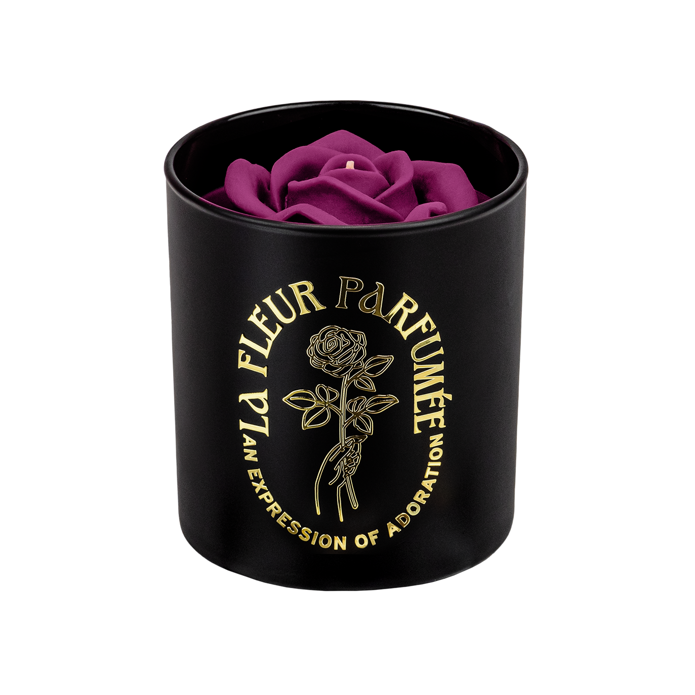 An elegant luxurious black orchid scent​candle with a gold emblem that reads La Fleur Parfumée An Expression of Adoration, and is topped with a purple sculpted wax rose 