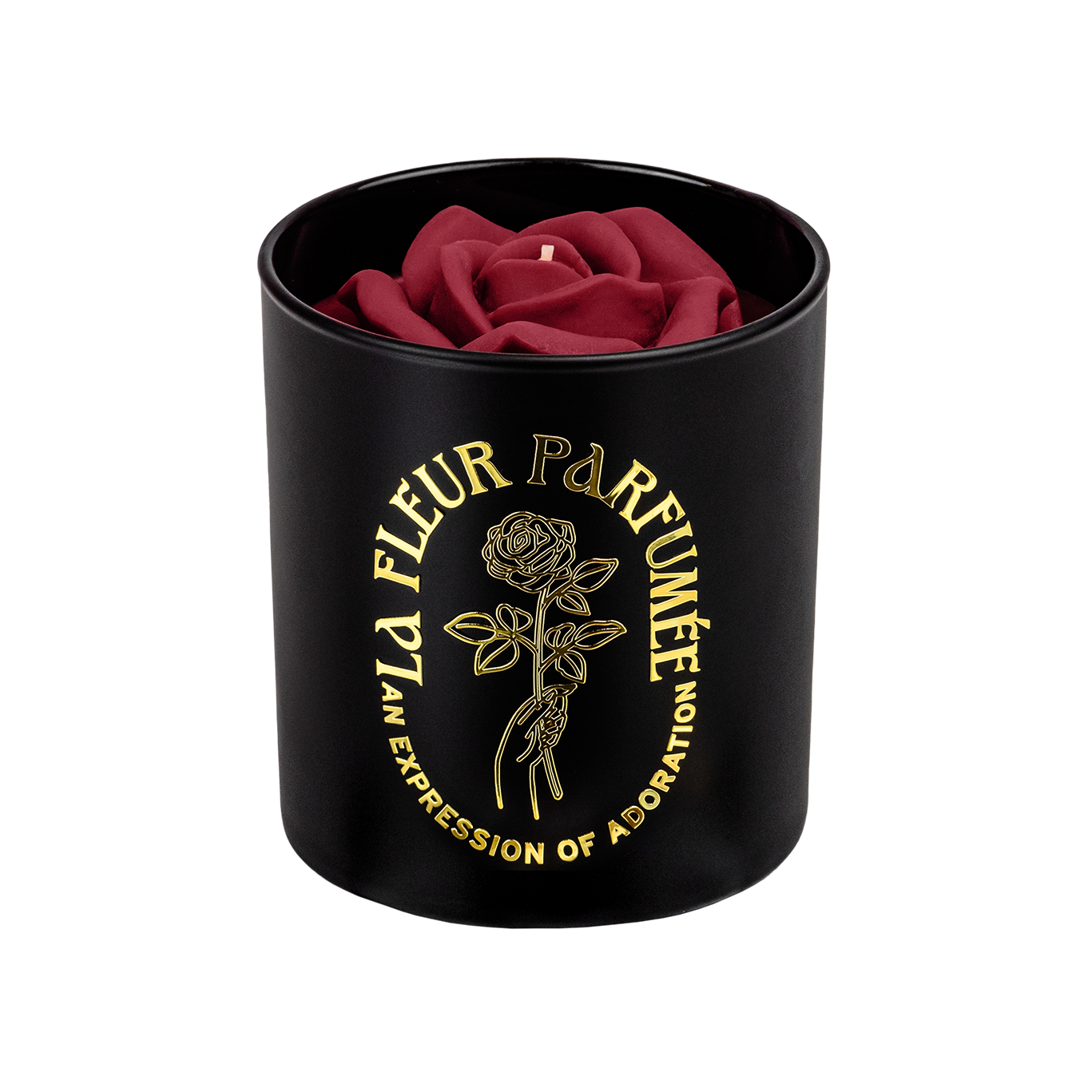 An elegant luxurious black candle with a gold emblem that reads La Fleur Parfumée An Expression of Adoration, and is topped with a red sculpted wax rose