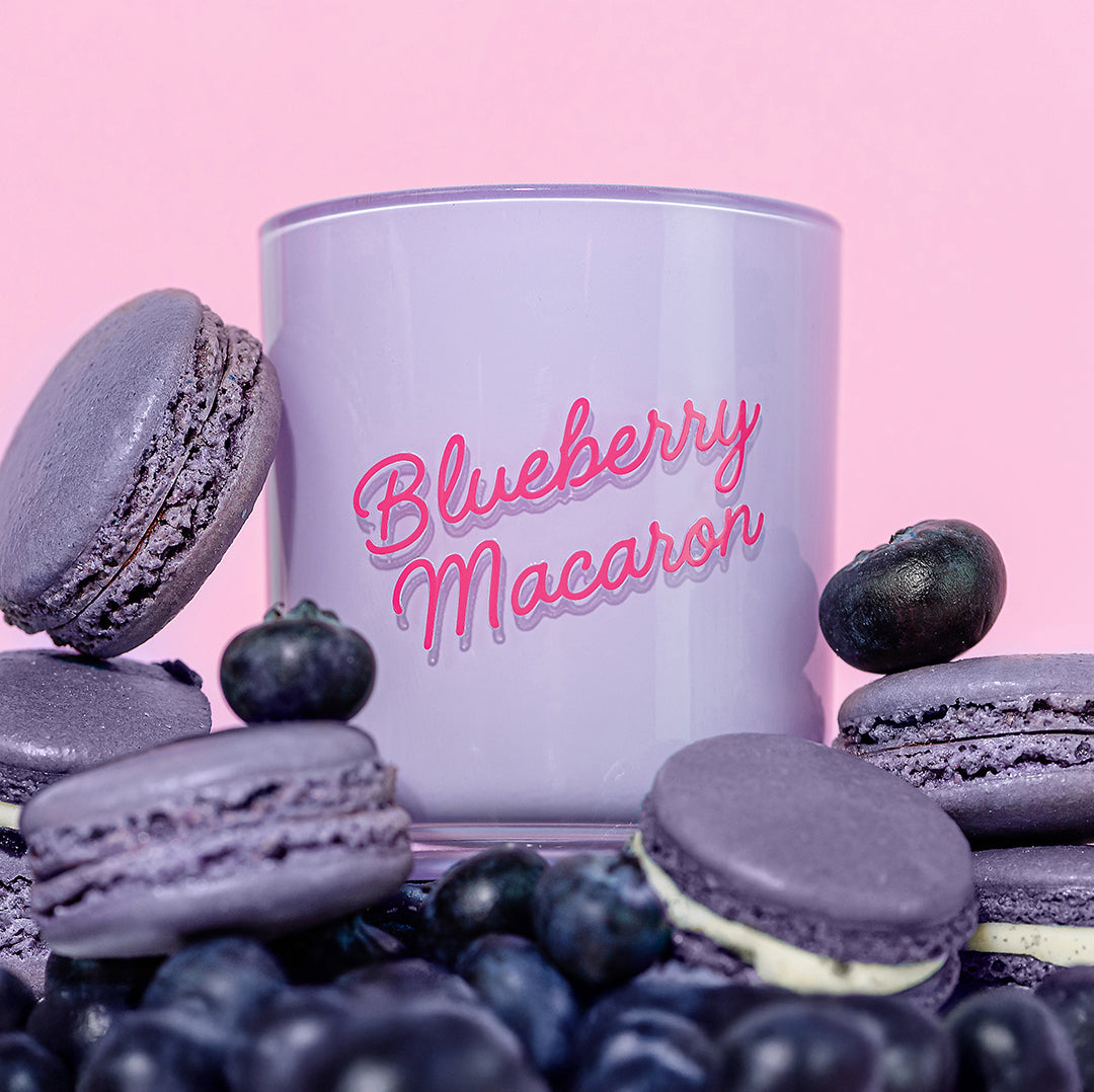 Candier Blueberry Macaron luxury candle styled with purple macarons and fresh blueberries. Aesthetic food candle with notes of gourmand fragrance and vanilla scent