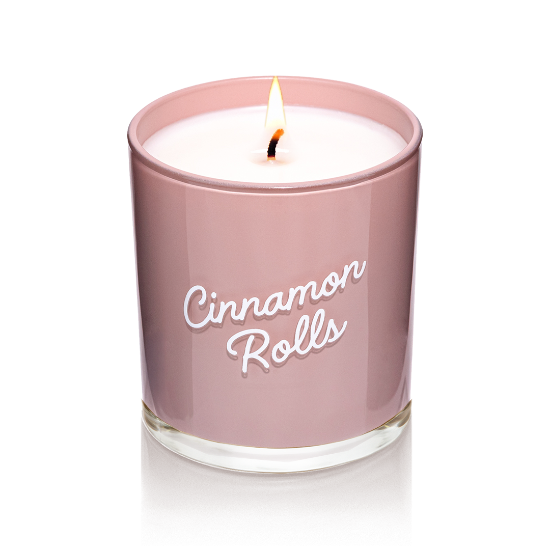 Candier Cinnamon Roll candle in glossy glass with white script. A  soy wax luxury candle with cinnamon roll glaze, vanilla fragrance, gourmand scent, and dessert candle vibes.
