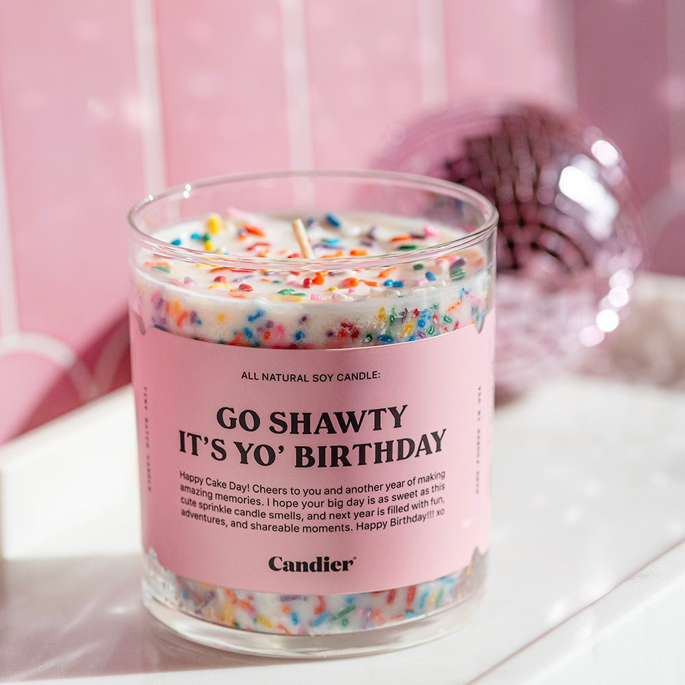 Candier iconic sprinkles candle with birthday cake scent of vanilla fragrance on dresser with cute pink aesthetic 