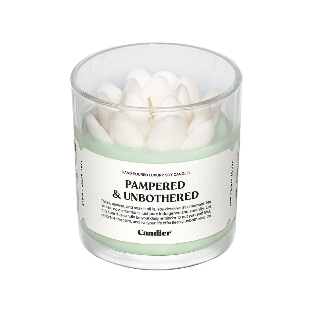 PAMPERED & UNBOTHERED SPA CANDLE by Candier with sculpted white lotus flower detail 