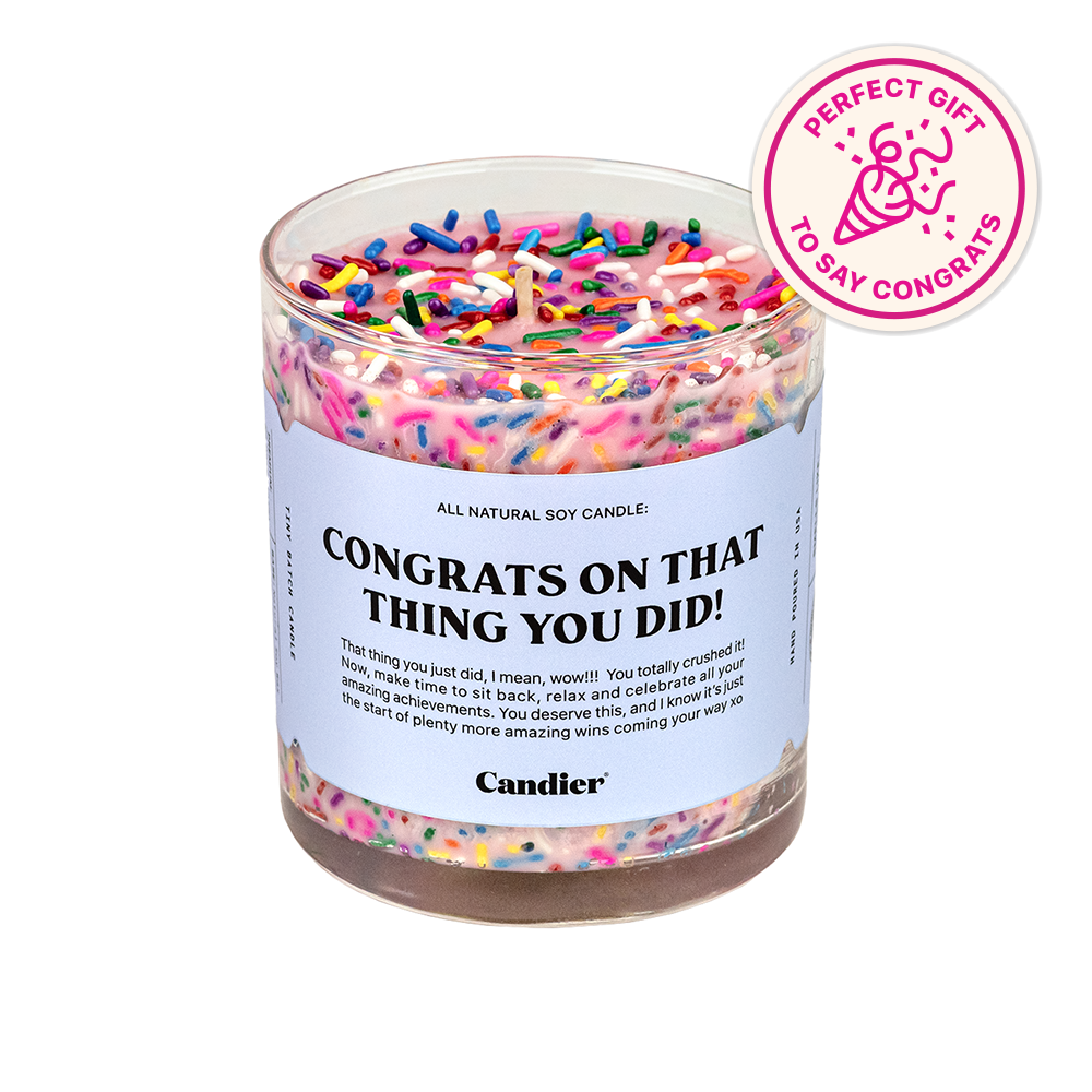 a colorful candle with a label that reads Congeats on that thing you did, and a badge that says perfect gift to say congrats 