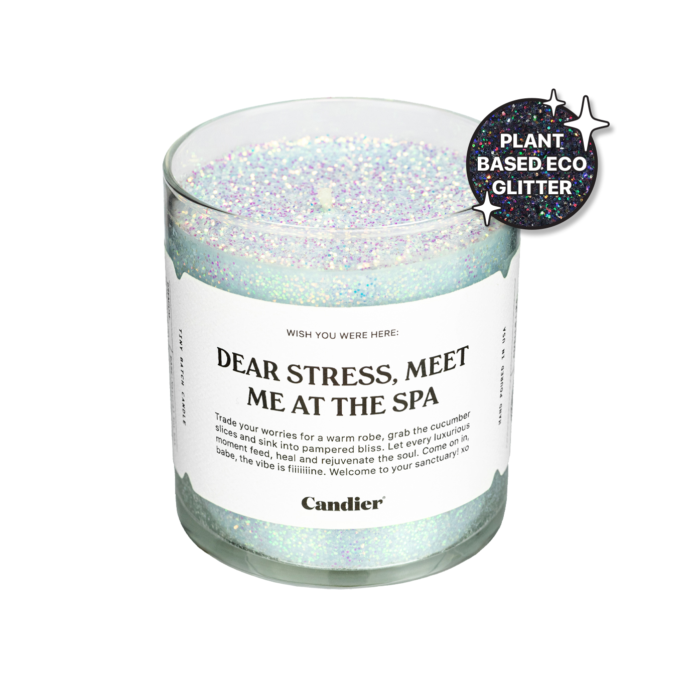 a sparkling ocean blue candle with plant based glitter and a label that reads Dear Stress Met Me At The Spa