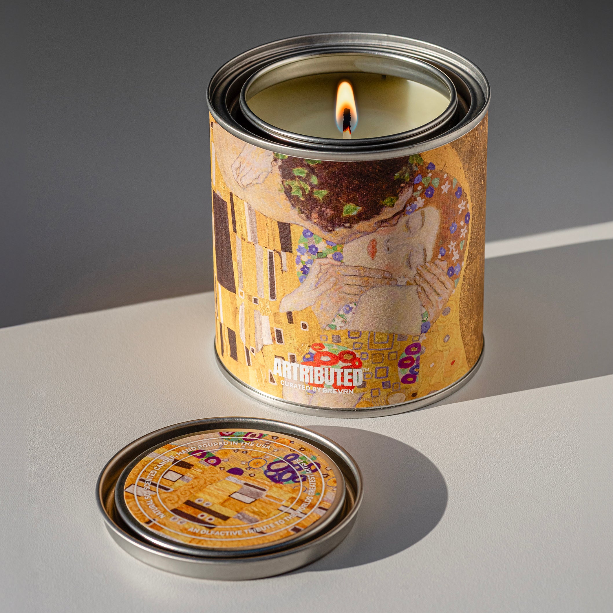 A premium candle wrapped in a high quality reproduction of Klimt's beloved The Kiss painting