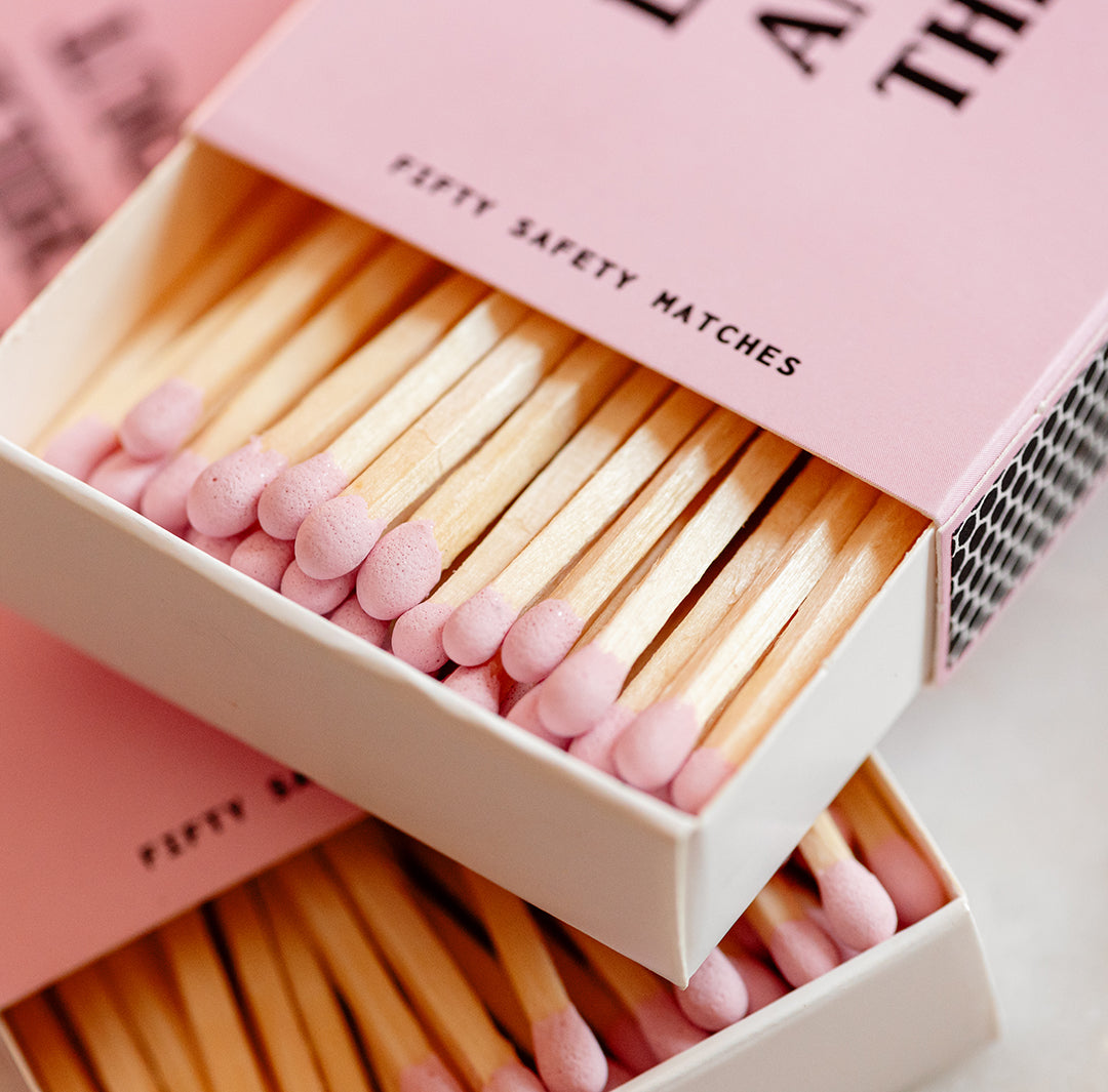 Candier pink matchbox featuring long matches for candles—the ultimate fancy matches for any home decor lover.