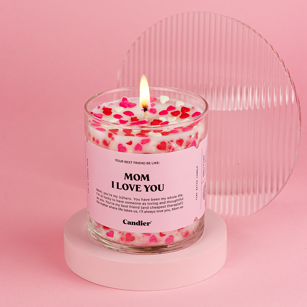 A candle with red and pink hearts, a label that reads Mom I Love You 