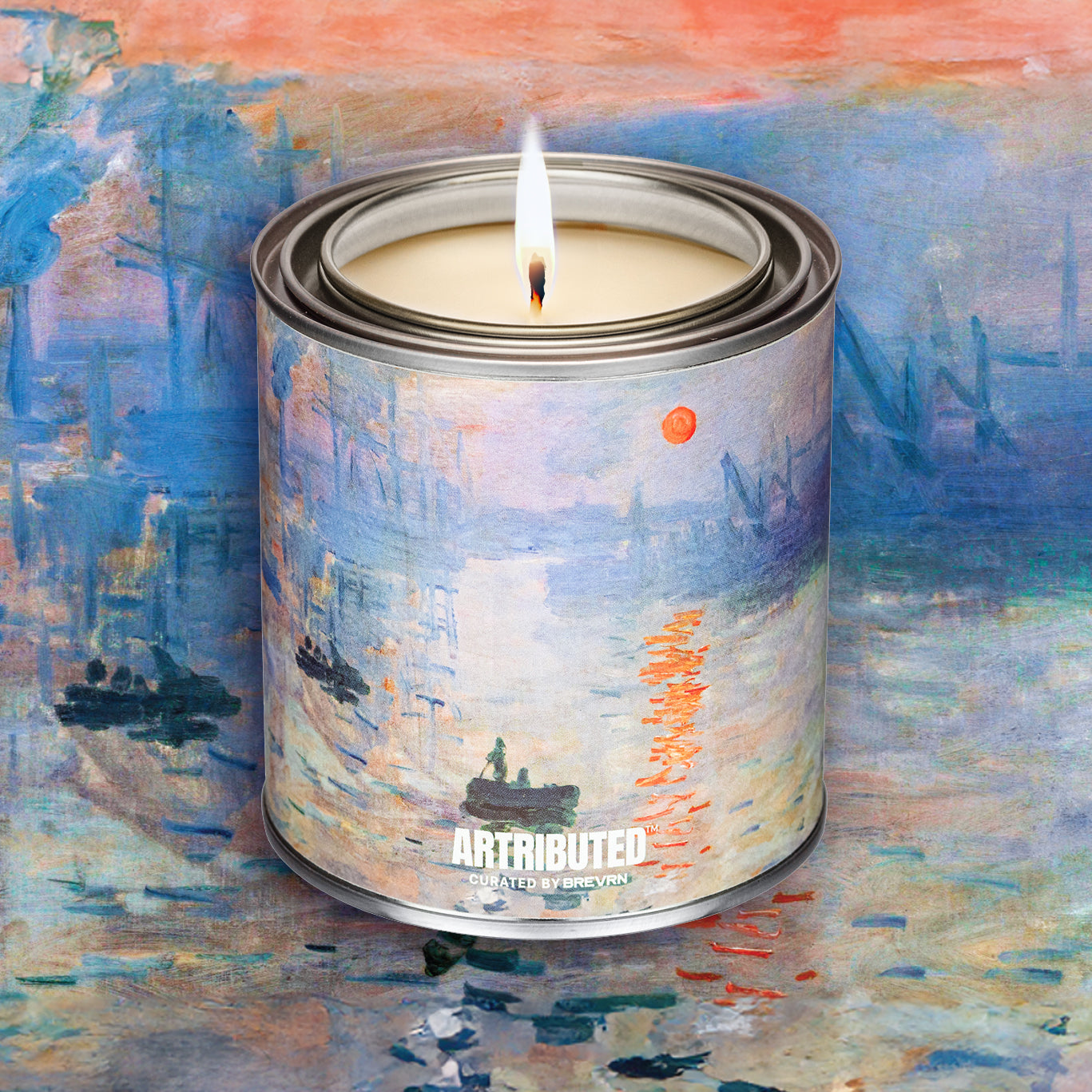 Lit fine art candle inspired by and wrapped in Monet famous painting  Impression, Sunrise. The background is filled with the painting