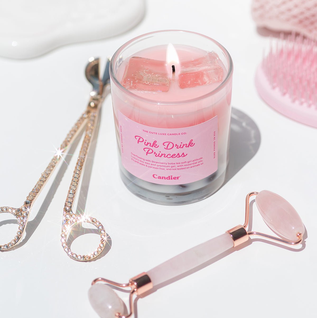 Candier cute candle labeled 'Pink Drink Princess' with a quartz roller and pink aesthetic 