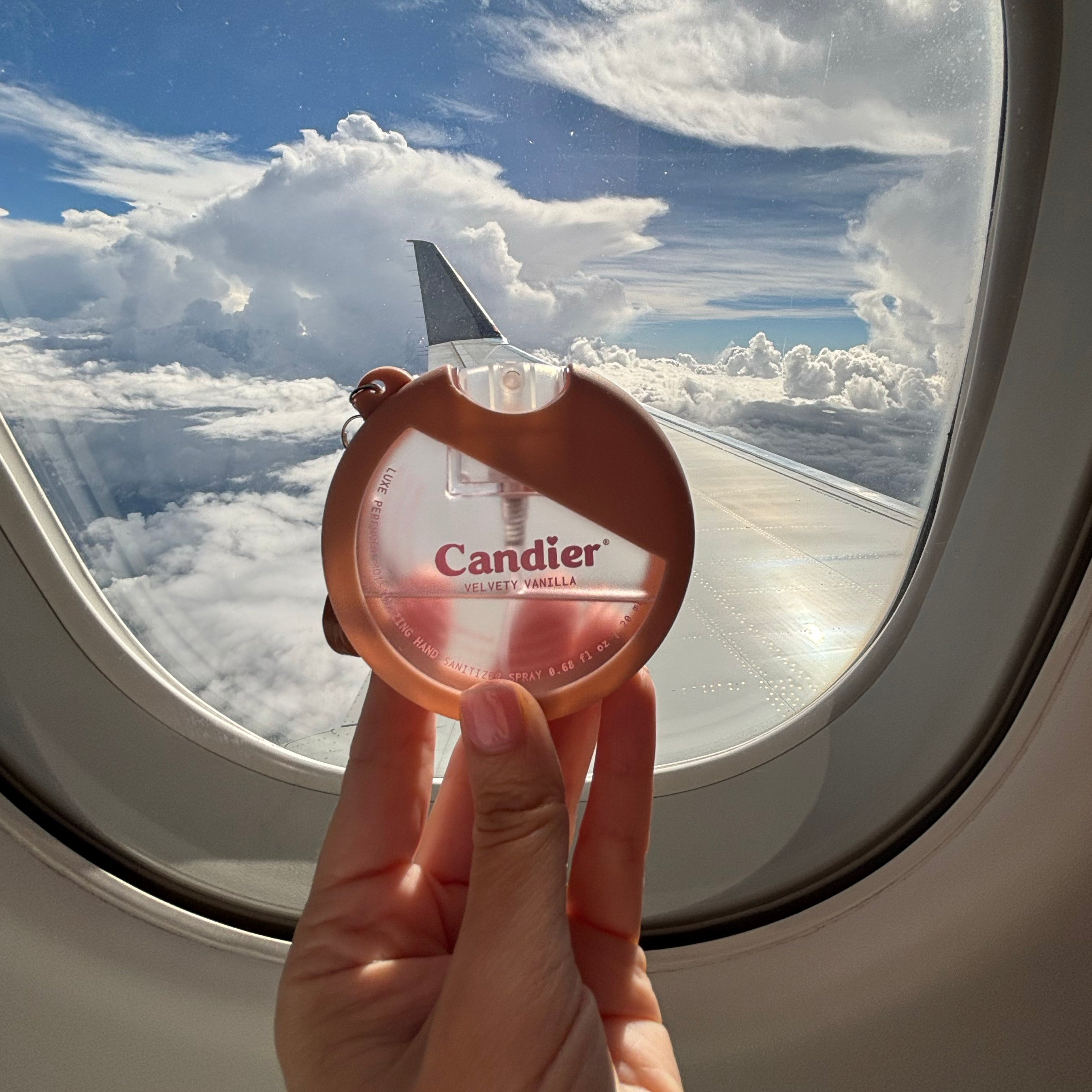 Candier cute travel hand sanitizer spray with sweet gourmand scent and vanilla fragrance perfect for plane and air travel