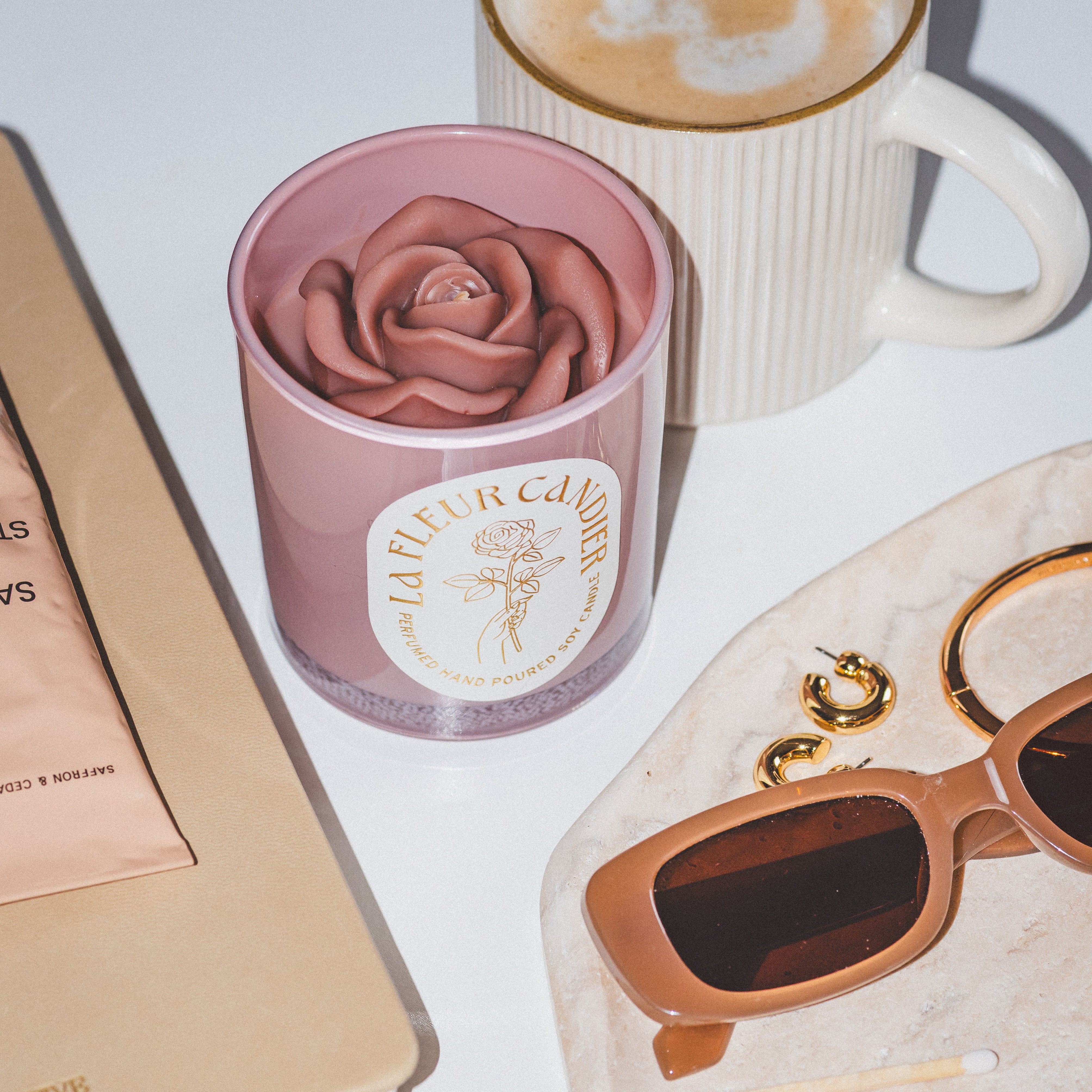 Candier candles flower candle styled with coffee and accessories, a cute candle with floral scents and aesthetic room decor