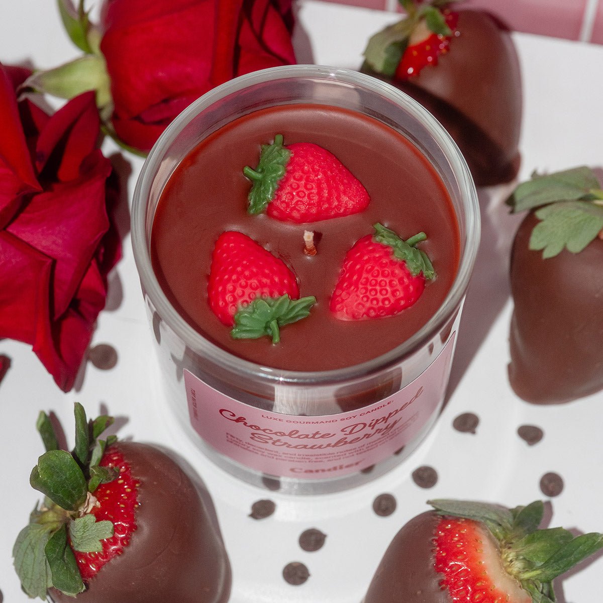 Top view of Candier Chocolate Dipped Strawberry candle showcasing realistic strawberry wax embeds and glossy chocolate-inspired wax