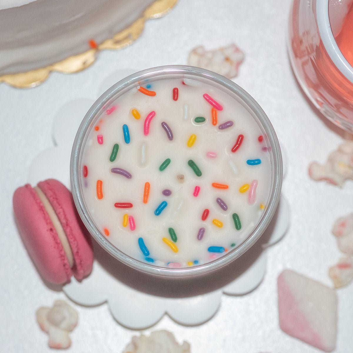 Top view of Candier Cupid’s Lil Cupcake vanilla sprinkle candle with colorful wax details, a cute Valentine candle and aesthetic gift for her