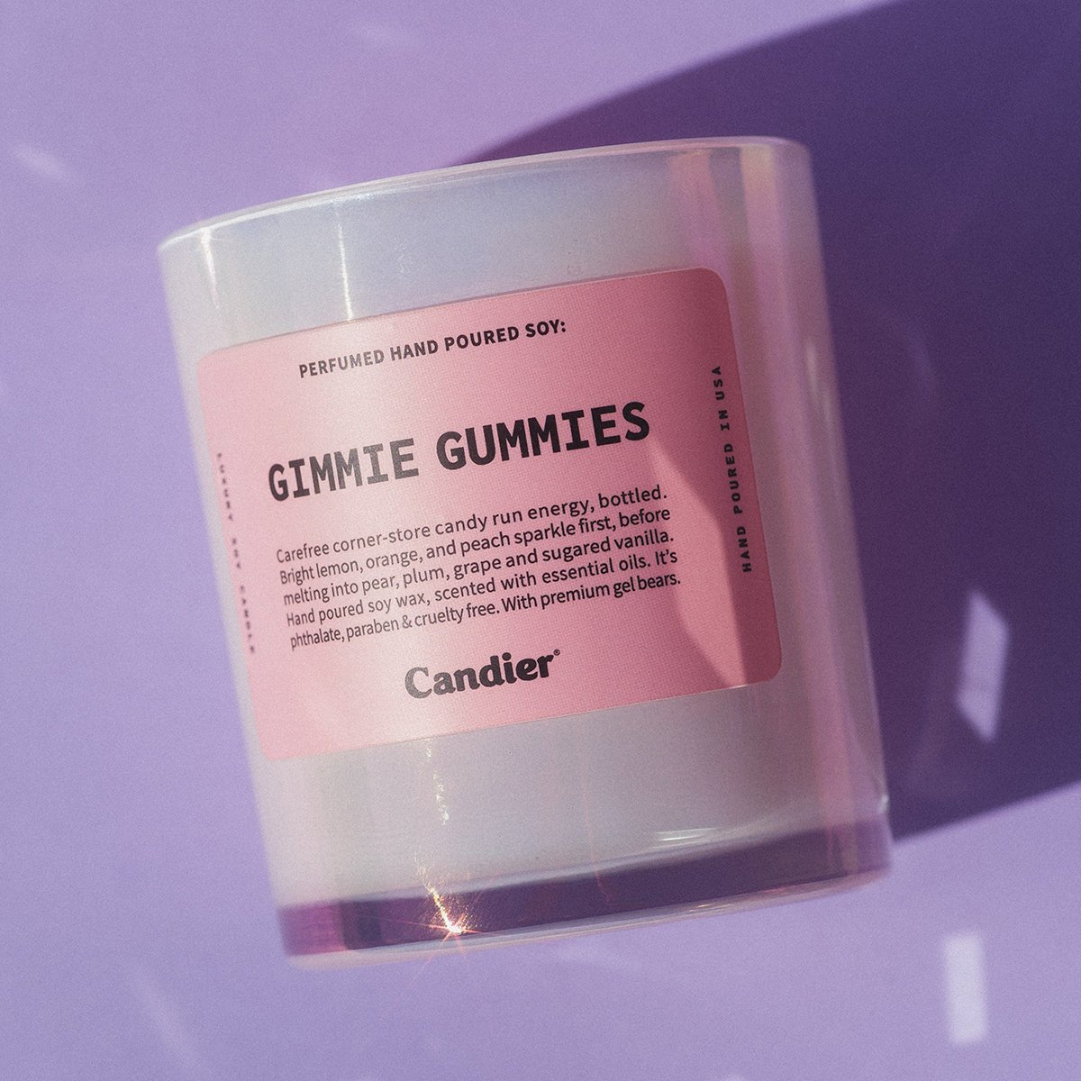 Candier Gimmie Gummies pink candle on pastel background, a luxury candle and cute gift for her with soft girl aesthetic styling