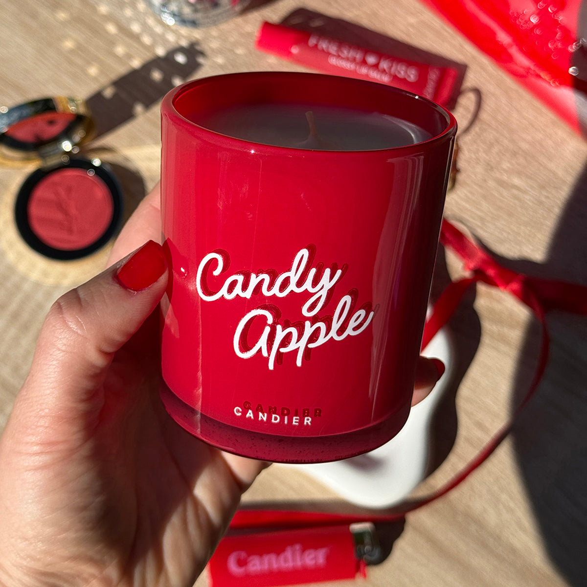 Lifestyle shot of apple cinnamon candle — perfect sweater weather candle and christmas gifts for friends.