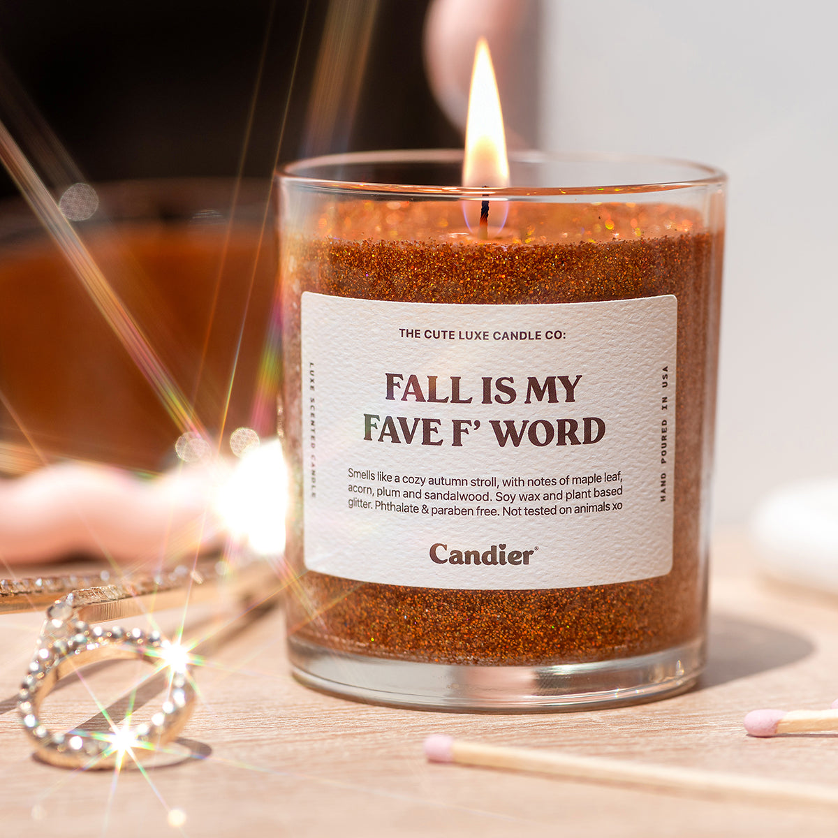 Fall scented candles from Candier, a luxe sweater weather candle glowing with autumn fragrance and cozy vibes.