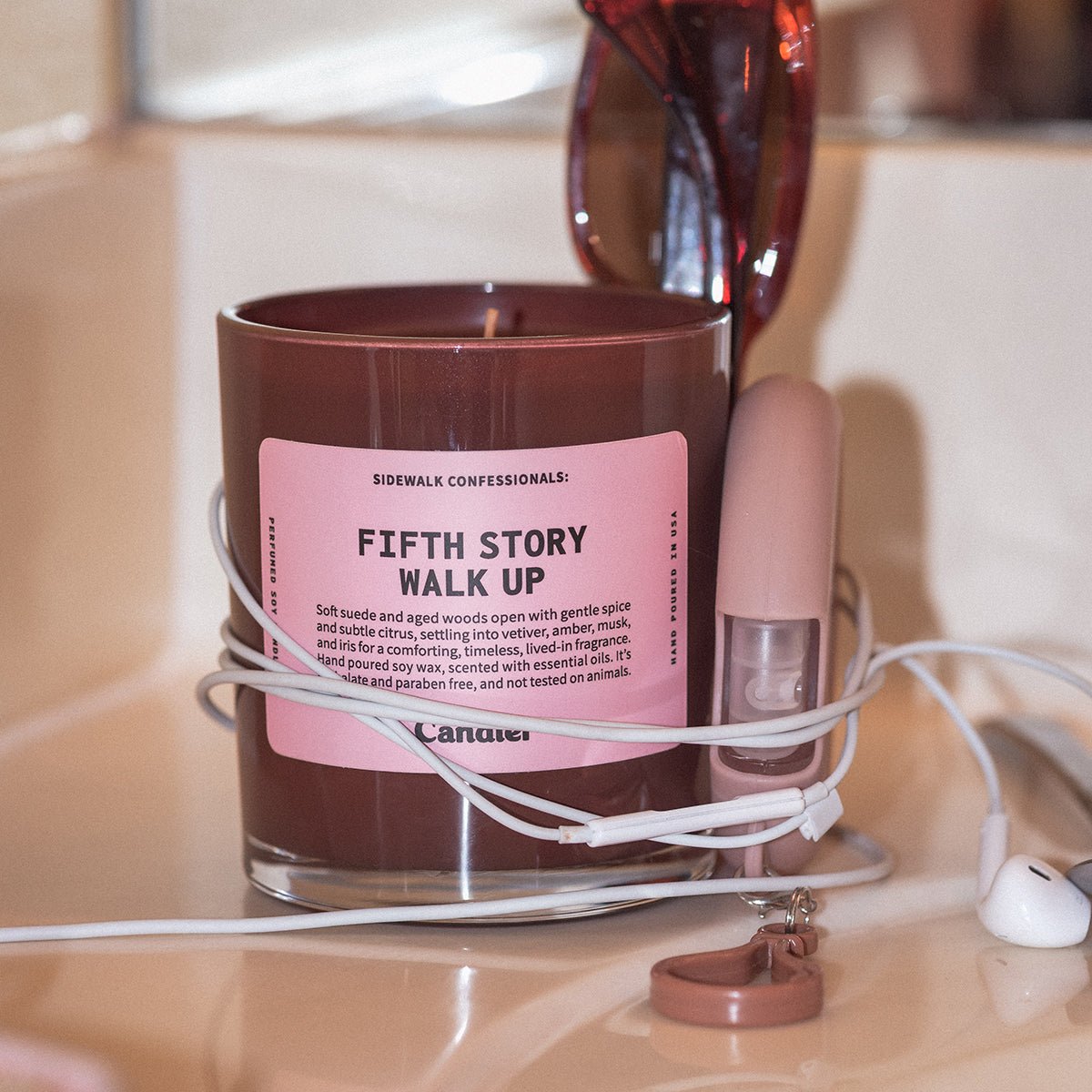 Candier Fifth Story Walk Up candle scent notes, woody amber fragrance NYC candle with cozy home aesthetic