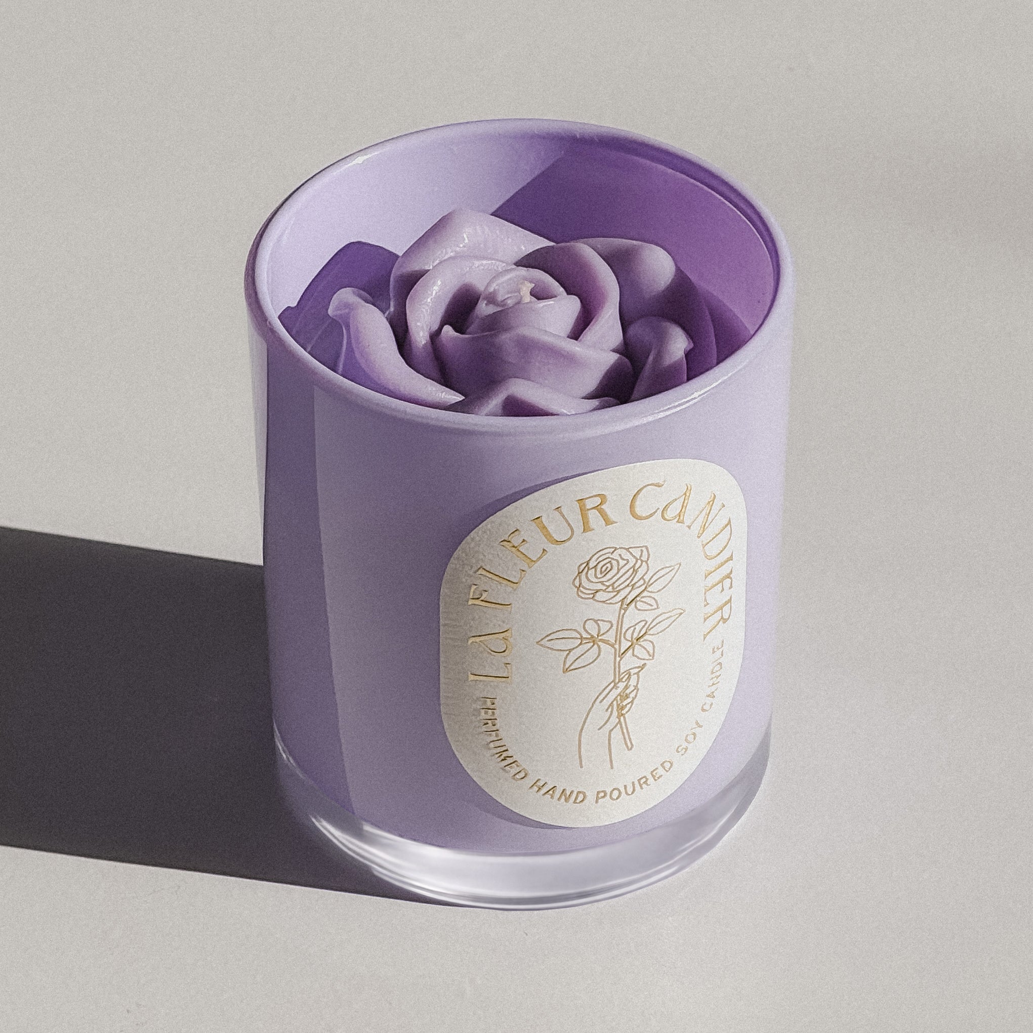 Jasmine Sambac flower candle in purple glass, a luxury floral candle with sculpted wax and elegant cute candle aesthetic